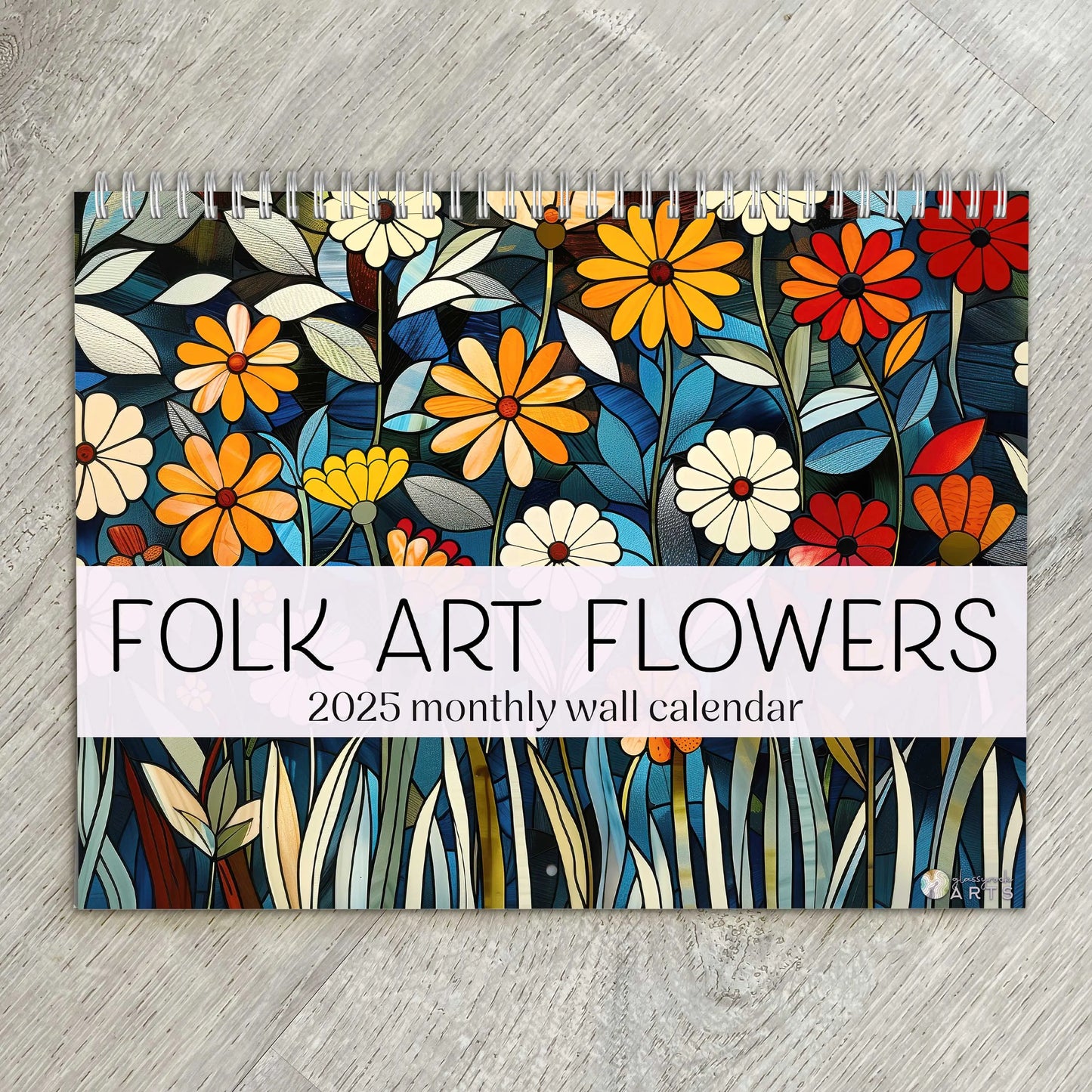 The 2025 Folk Art Flowers Wall Calendar features vibrant, stylized flowers with a stained glass aesthetic set against a rustic wooden background.