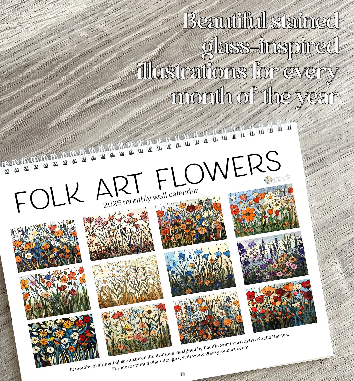 The 2025 Folk Art Flowers Wall Calendar features vibrant stained glass-inspired floral illustrations each month, beautifully set on a wooden surface and highlighting its stunning compositions.