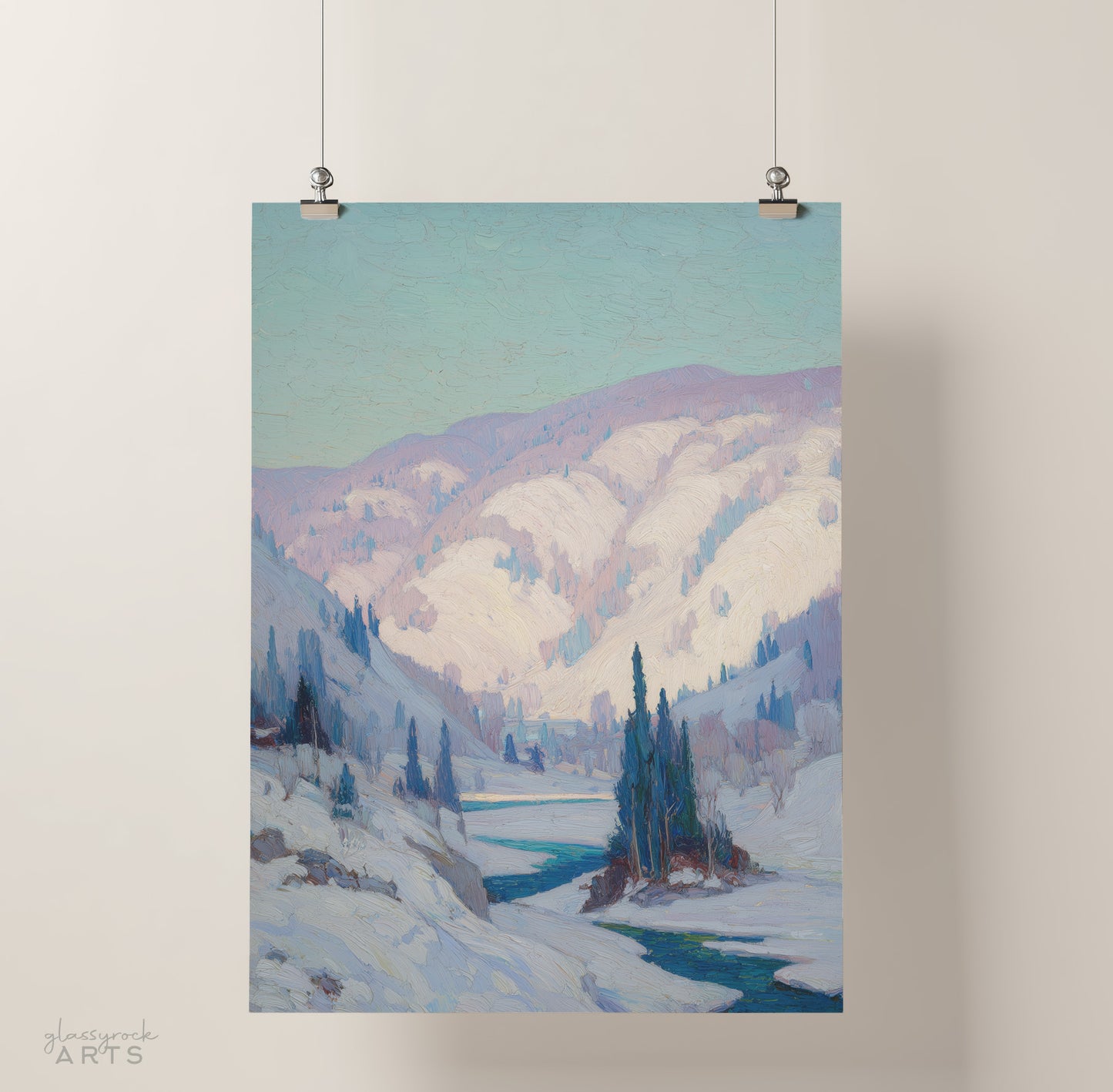 Winter landscape painting with mountains and a lake, hanging on a light gray wall.