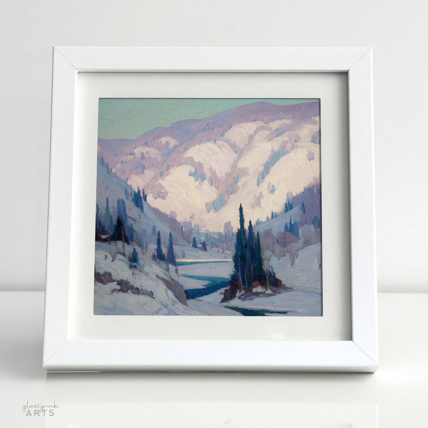 Framed painting of a winter landscape with mountains and a lake.