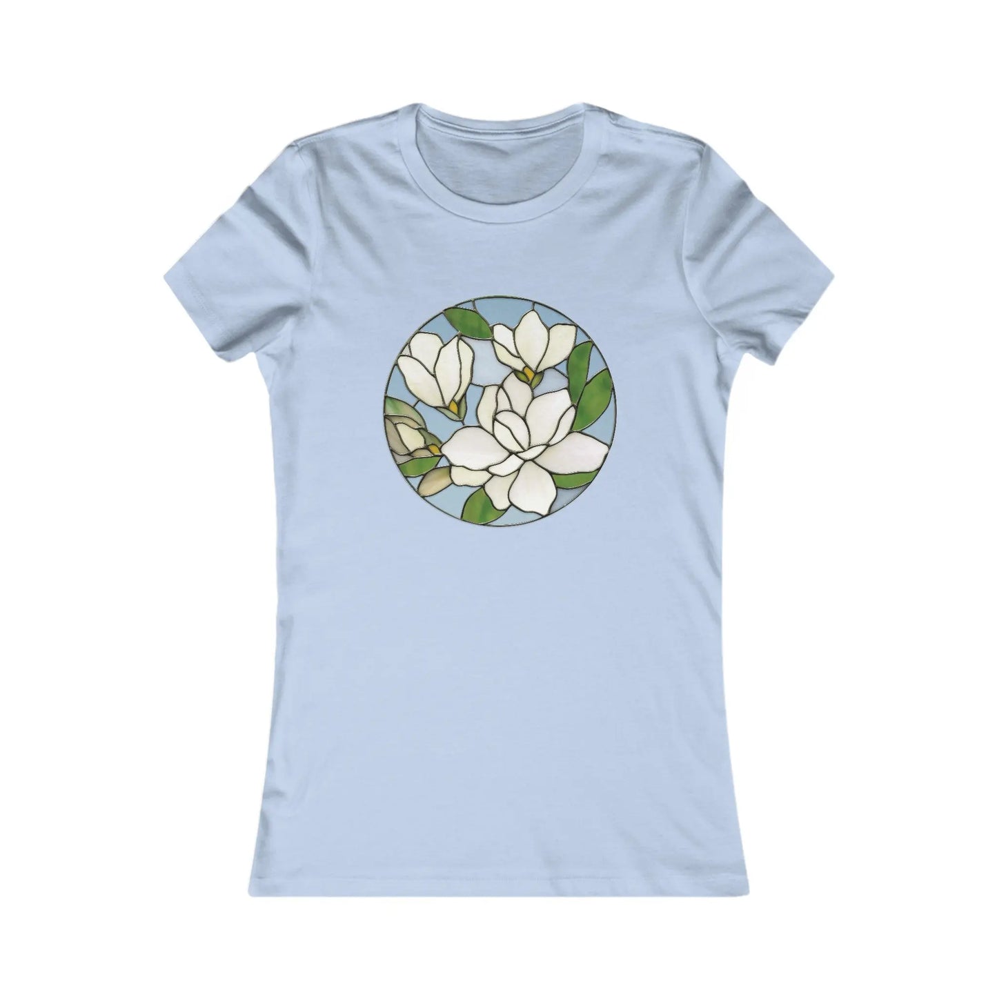 The Stained Glass Magnolia Womens Tee Shirt is a light blue, comfortable top featuring a round stained glass design with white flowers and green leaves, ideal for highlighting sustainable fashion.