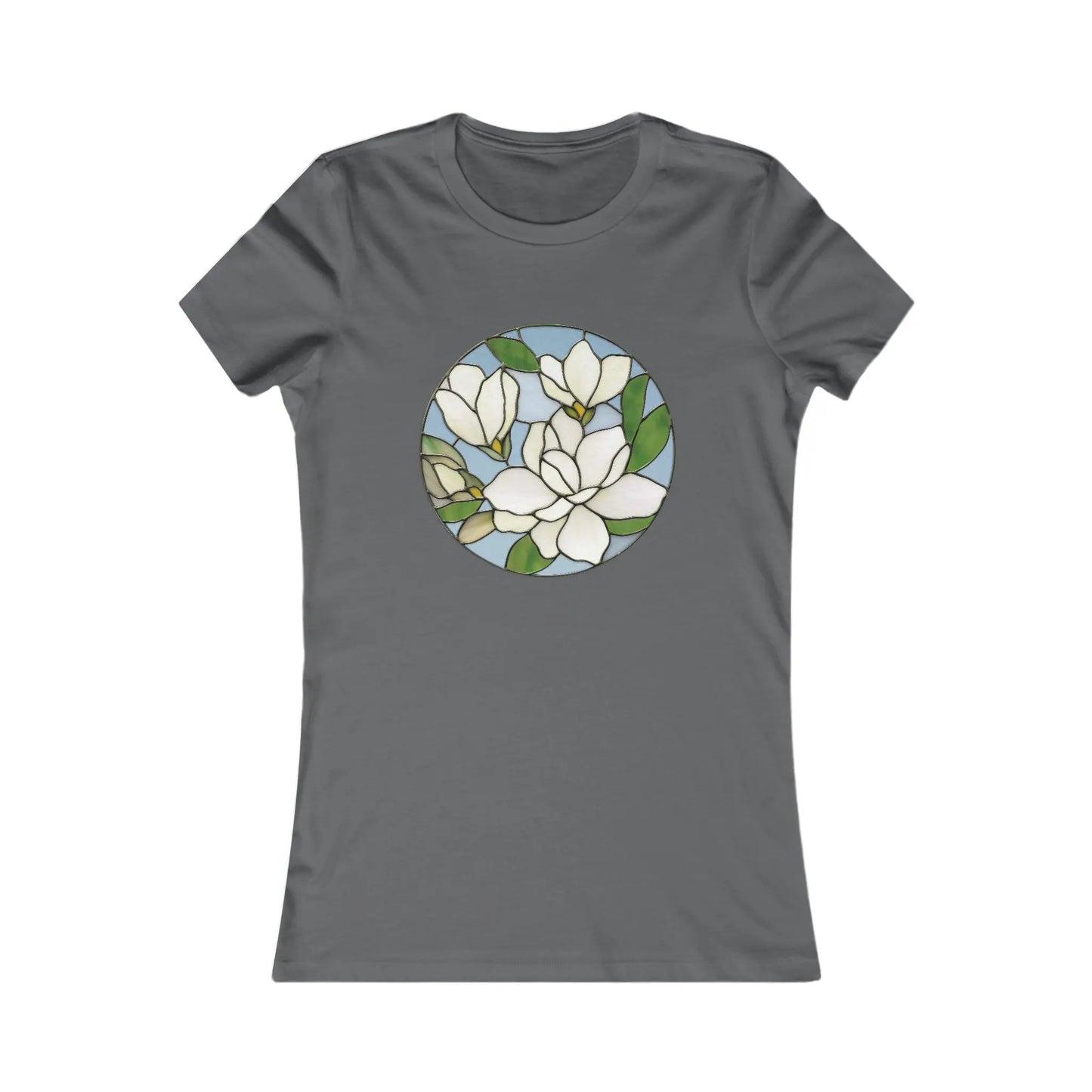 The Stained Glass Magnolia Womens Tee Shirt features a dark gray hue and a beautiful circular stained glass design with white magnolia flowers, green leaves, and a light blue background. Made from sustainable materials, its both stylish and eco-friendly.