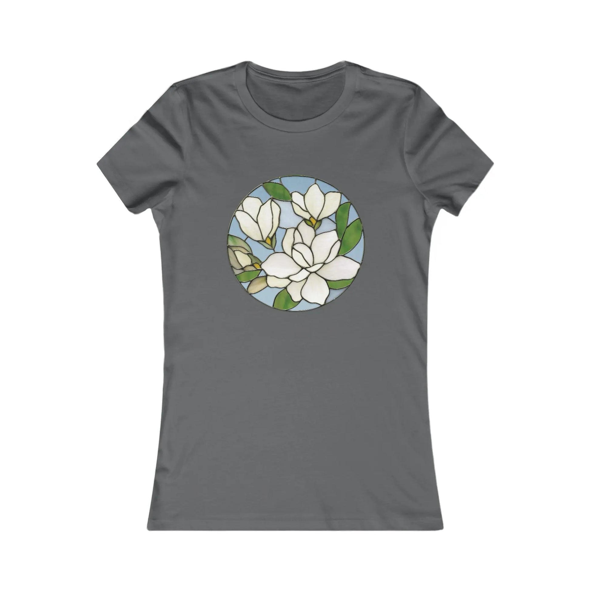 The Stained Glass Magnolia Womens Tee Shirt features a dark gray hue and a beautiful circular stained glass design with white magnolia flowers, green leaves, and a light blue background. Made from sustainable materials, its both stylish and eco-friendly.