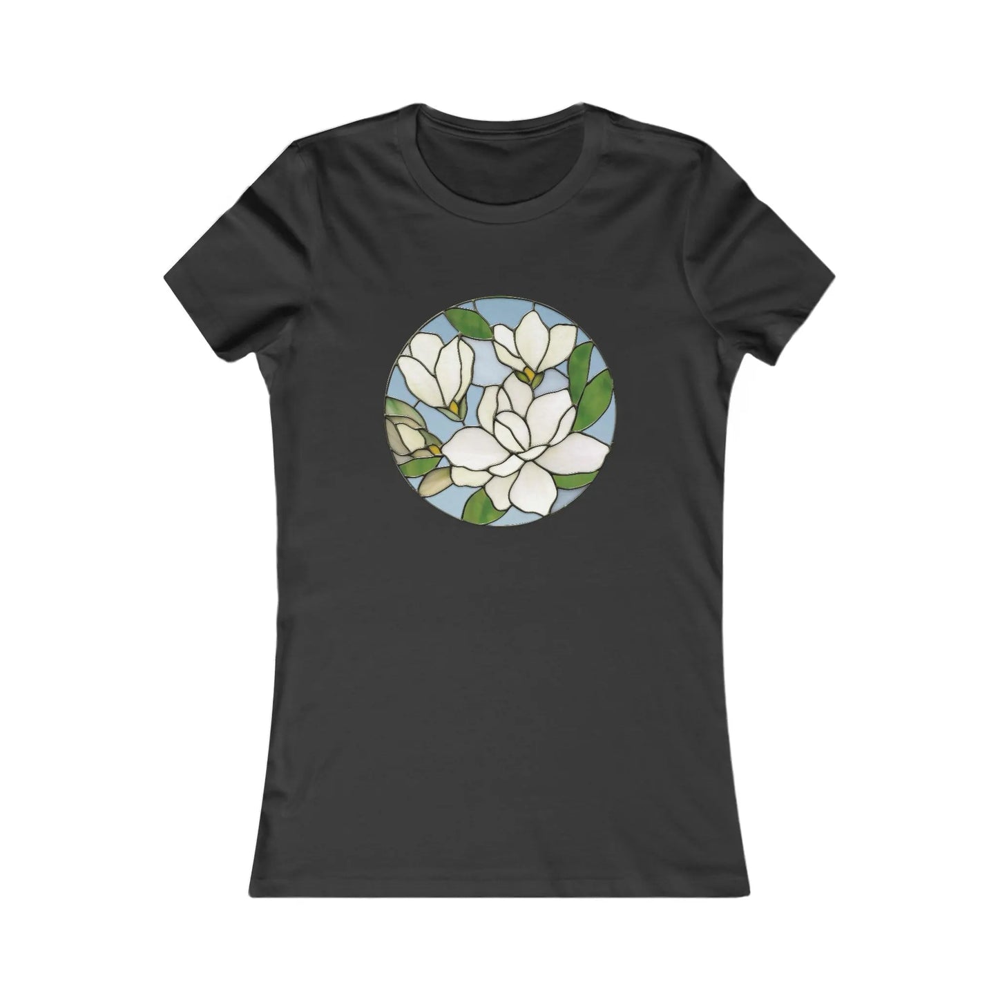 The Stained Glass Magnolia Womens Tee Shirt features a black T-shirt with a stained glass-style design of white magnolia flowers and green leaves on a light blue background, part of our sustainable line, combining comfort with eco-friendly elegance.
