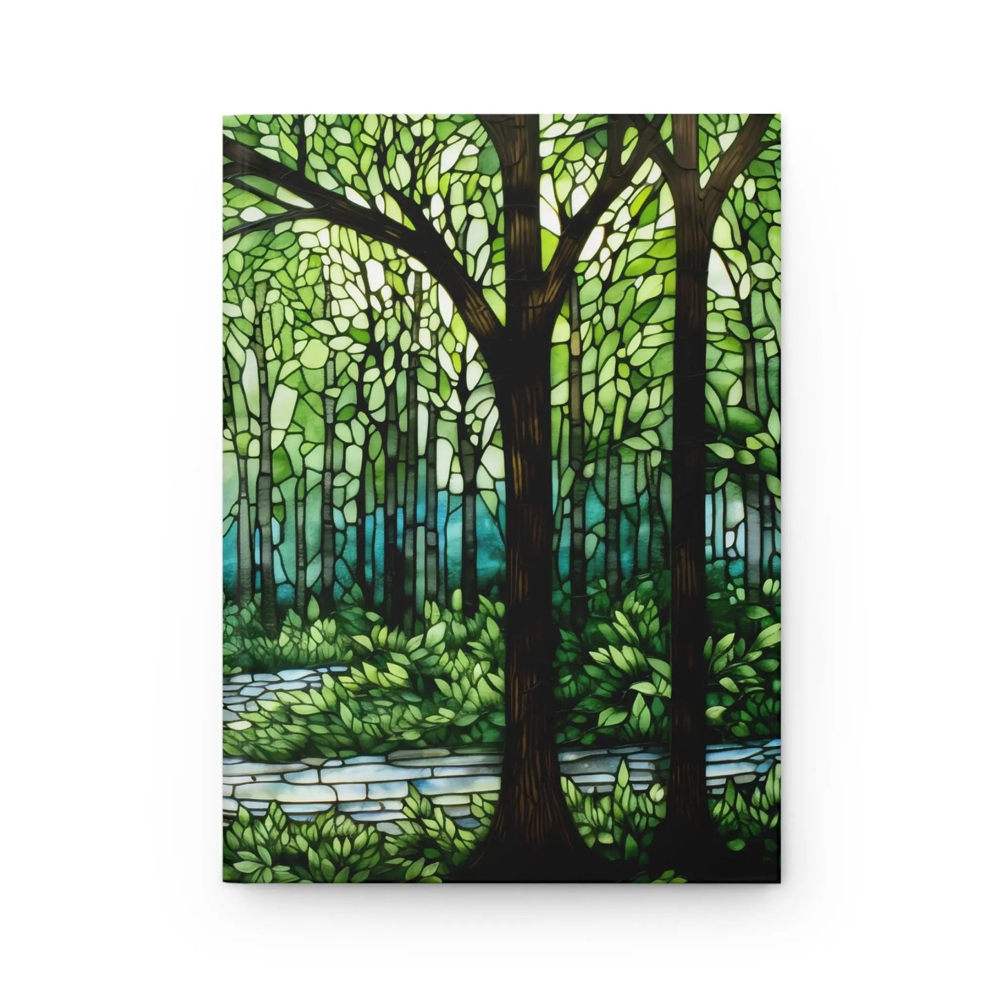 The Stained Glass Forest Hardcover Journal showcases a custom stained glass forest scene with tall trees, green canopies, and a winding path. Sunlight creates light and shadow patterns, evoking serenity and enchantment—an ideal gift for art lovers.