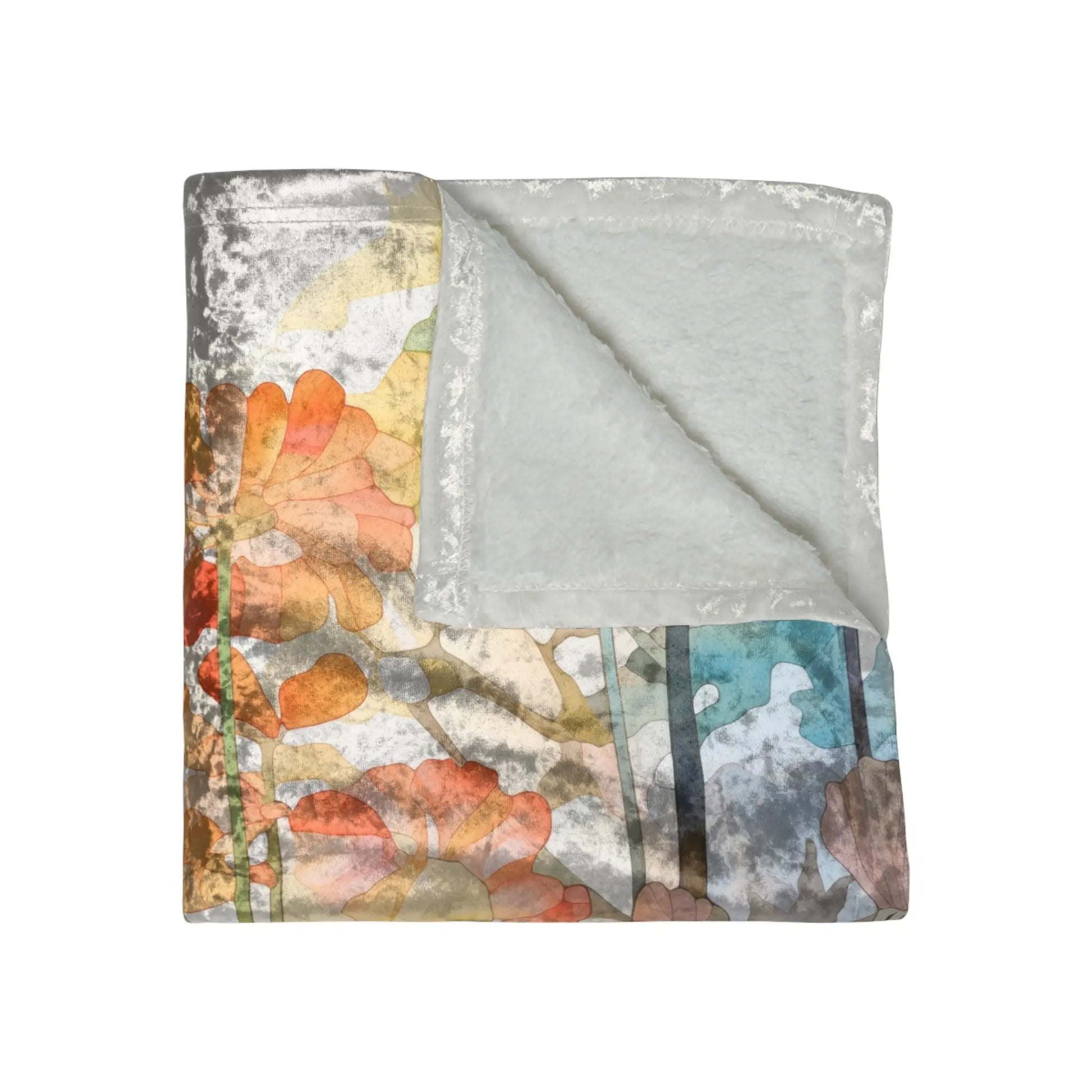 The Stained Glass Flowers & Ferns blanket features a crushed velvet front with an abstract stained glass design in orange, blue, and green on grey, while the soft fleece underside provides cozy comfort. Size: 50x60.
