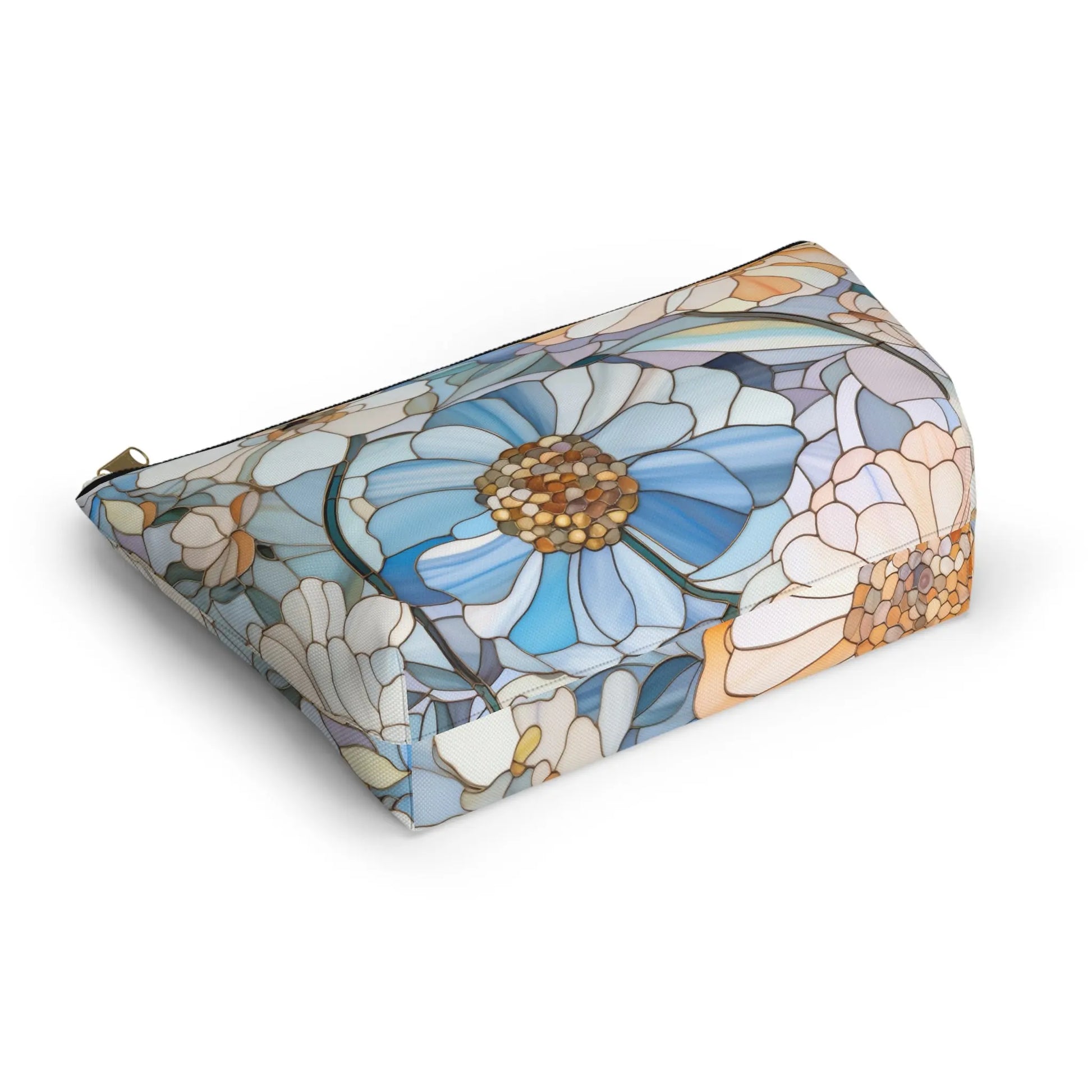 The Stained Glass Flowers Cosmetic Bag features a floral design with large blue and white flowers, green leaves, and a light background. Its soft, watercolor-like appearance adds boho charm.