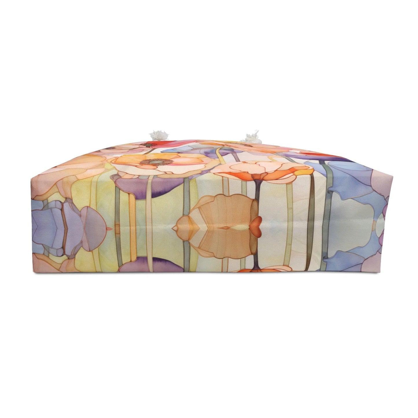 The Stained Glass Rainbow Poppies Oversized Tote Bag features a colorful abstract floral pattern in pastel orange, purple, blue, and green. It resembles stained glass with poppy flowers and has sturdy rope handles for easy carrying.