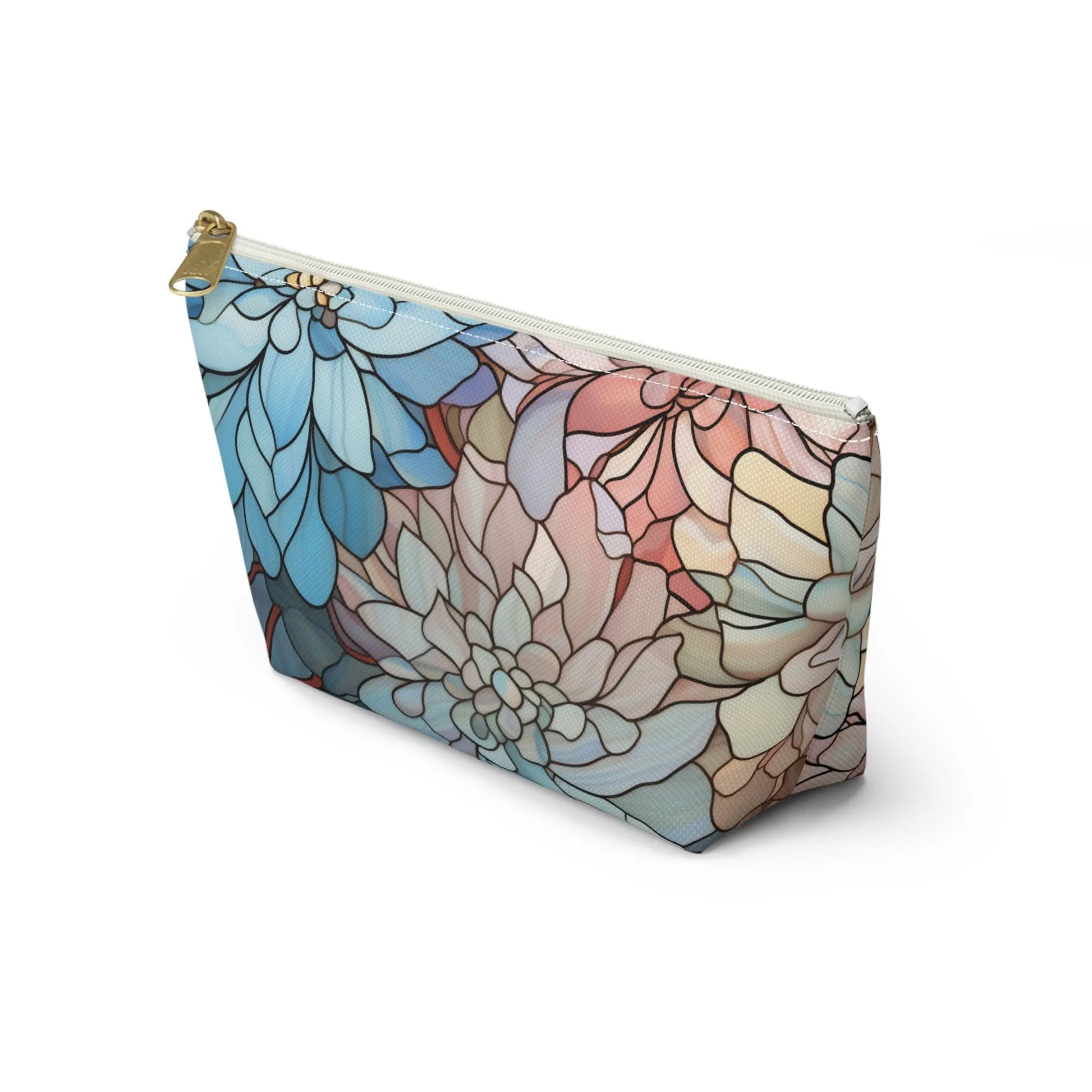 The Stained Glass Dark Flowers Cosmetic Bag is a zippered pouch with a floral design in blue, pink, and tan. Featuring petal-like patterns on white and a gold zipper accent, its ideal as a cosmetic bag or boho gift.