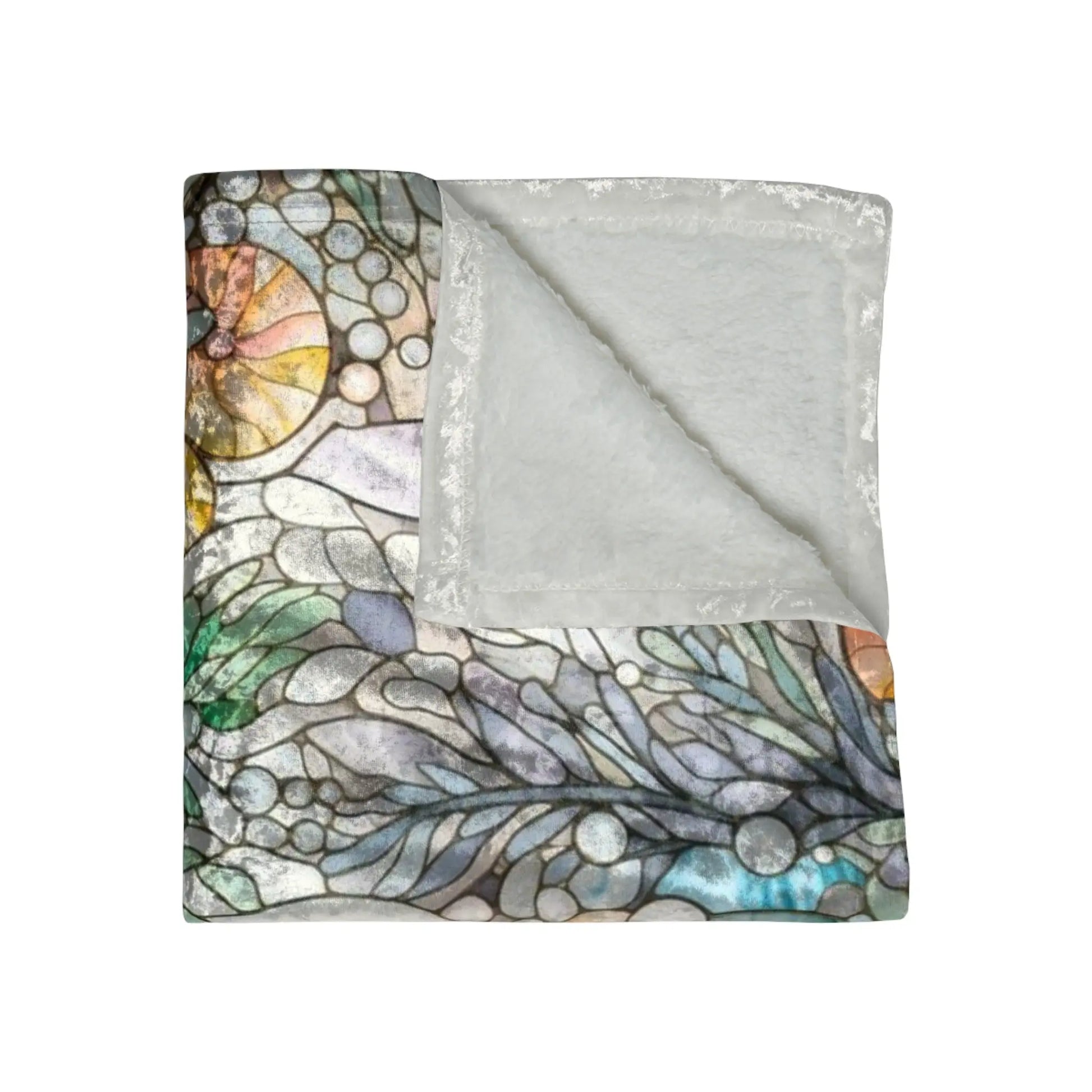 The Stained Glass Rainbow Ferns Forest Crushed Velvet Blanket - 50x60, features a soft white underside and a stunning stained glass design on top, with swirling colors reminiscent of rainbow ferns, leaves, and shells.