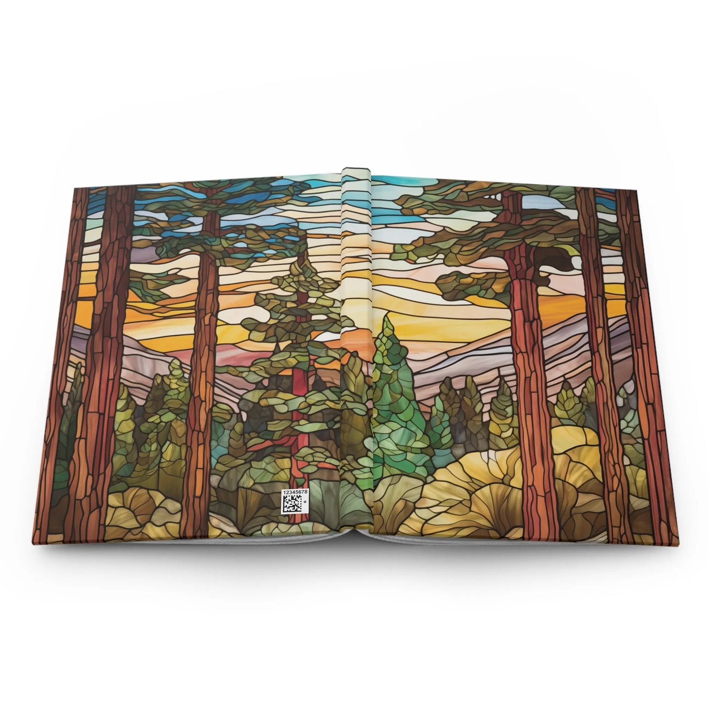 The Stained Glass Sequoia Forest Hardcover Journal showcases an open book with a stained glass-style illustration of a forest, tall trees, mountains, and a sunset sky. Vivid colors and intricate patterns mimic mosaic art, providing a unique custom creation experience.