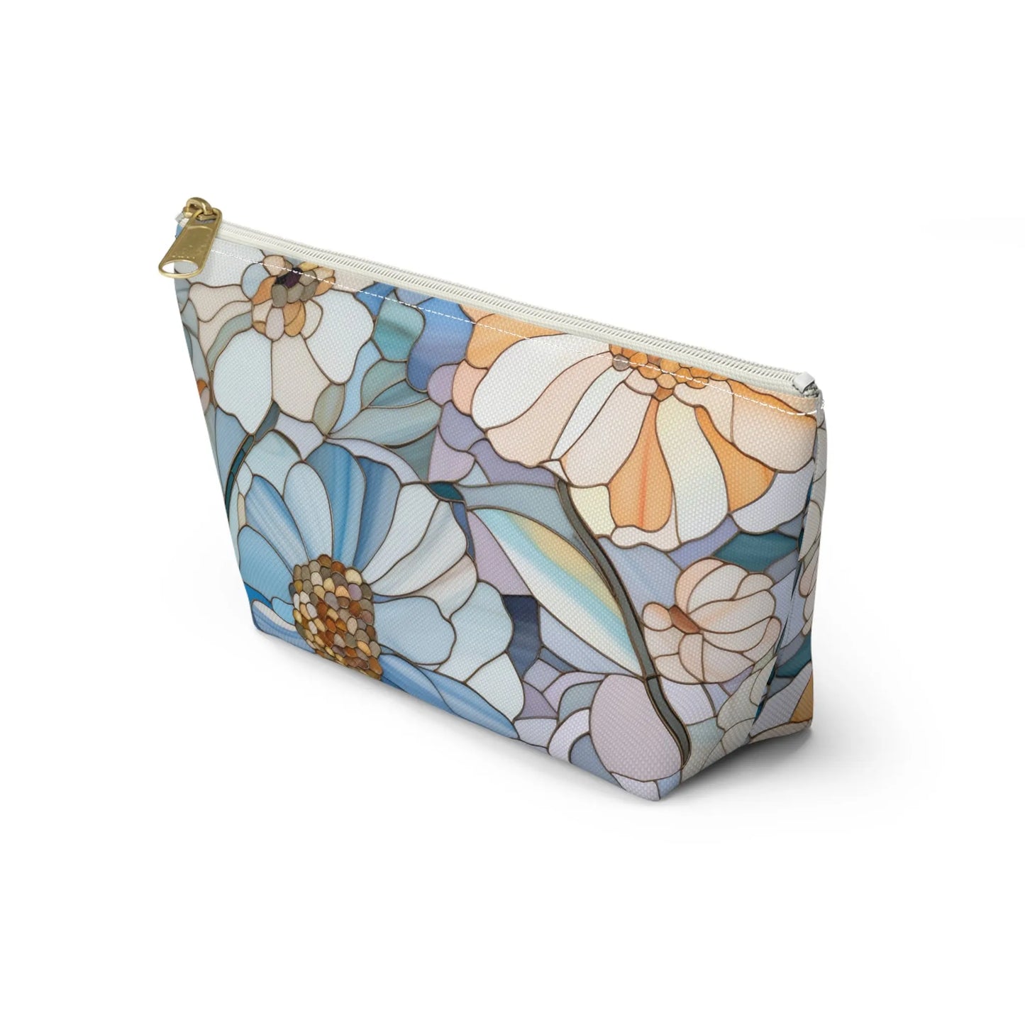 The Stained Glass Flowers Cosmetic Bag is a rectangular pouch with a bohemian twist, showcasing a floral stained glass pattern in blues, oranges, and whites. Large flowers and petals adorn the design, complemented by a gold zipper—ideal for a distinctive stained glass gift.
