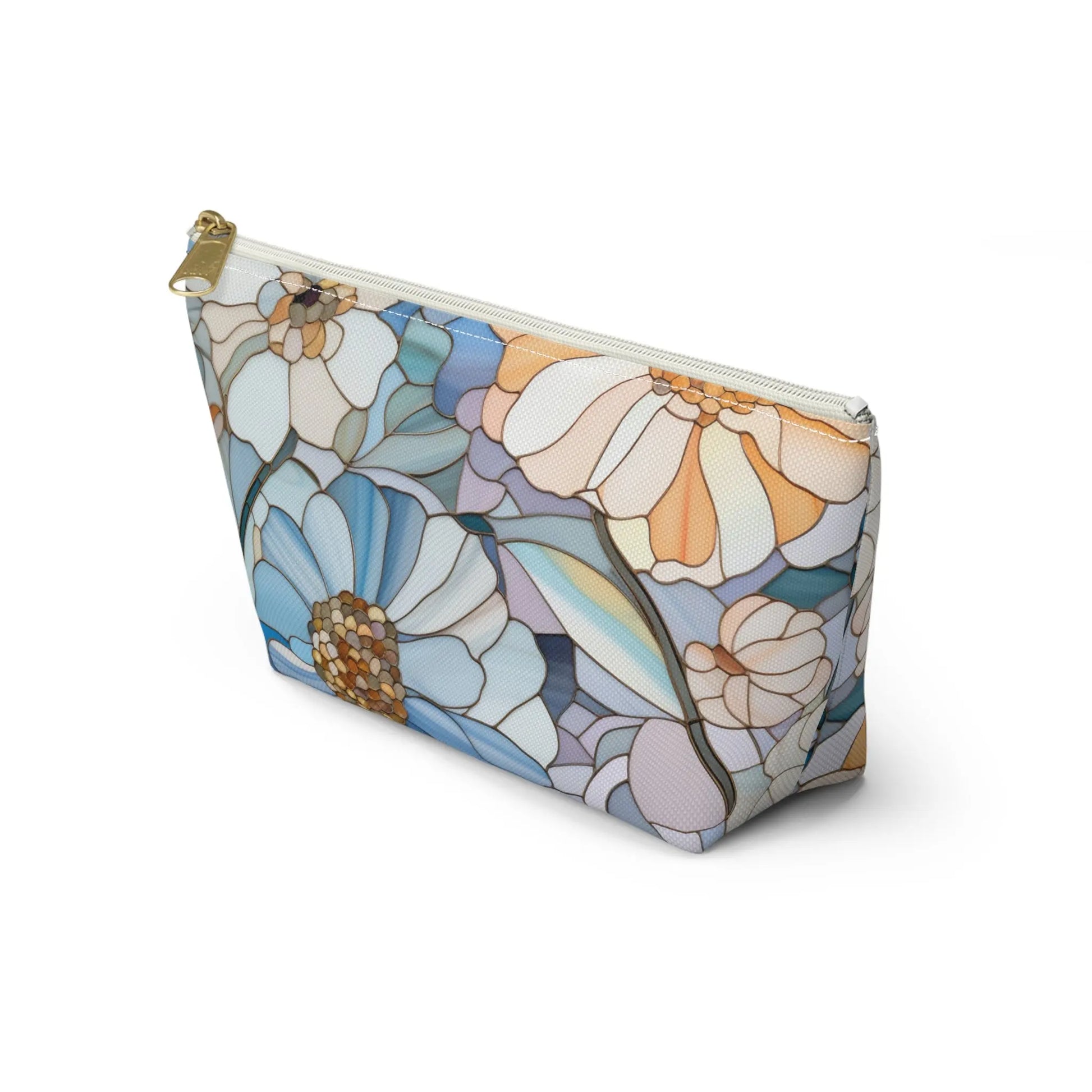 The Stained Glass Flowers Cosmetic Bag is a rectangular pouch with a bohemian twist, showcasing a floral stained glass pattern in blues, oranges, and whites. Large flowers and petals adorn the design, complemented by a gold zipper—ideal for a distinctive stained glass gift.