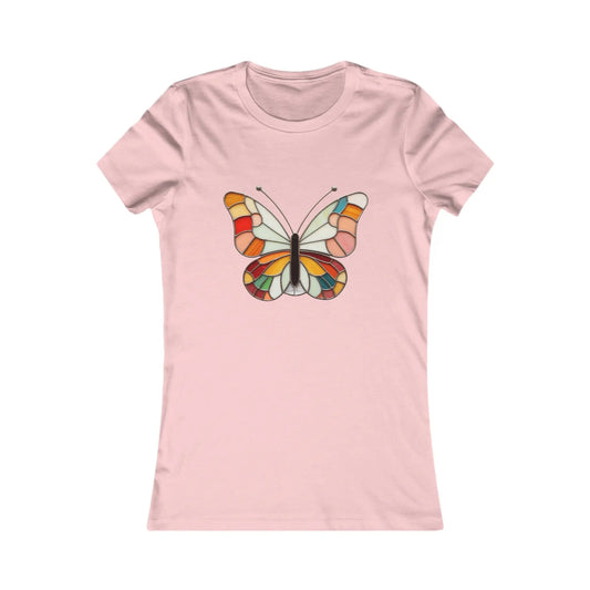 The Stained Glass Groovy Butterfly Womens Tee Shirt by Bella+Canvas features a vibrant butterfly design with hues of red, orange, yellow, green, and blue. Its stained glass effect adds a stunning patterned look to this pink tee, part of our sustainable clothing collection.
