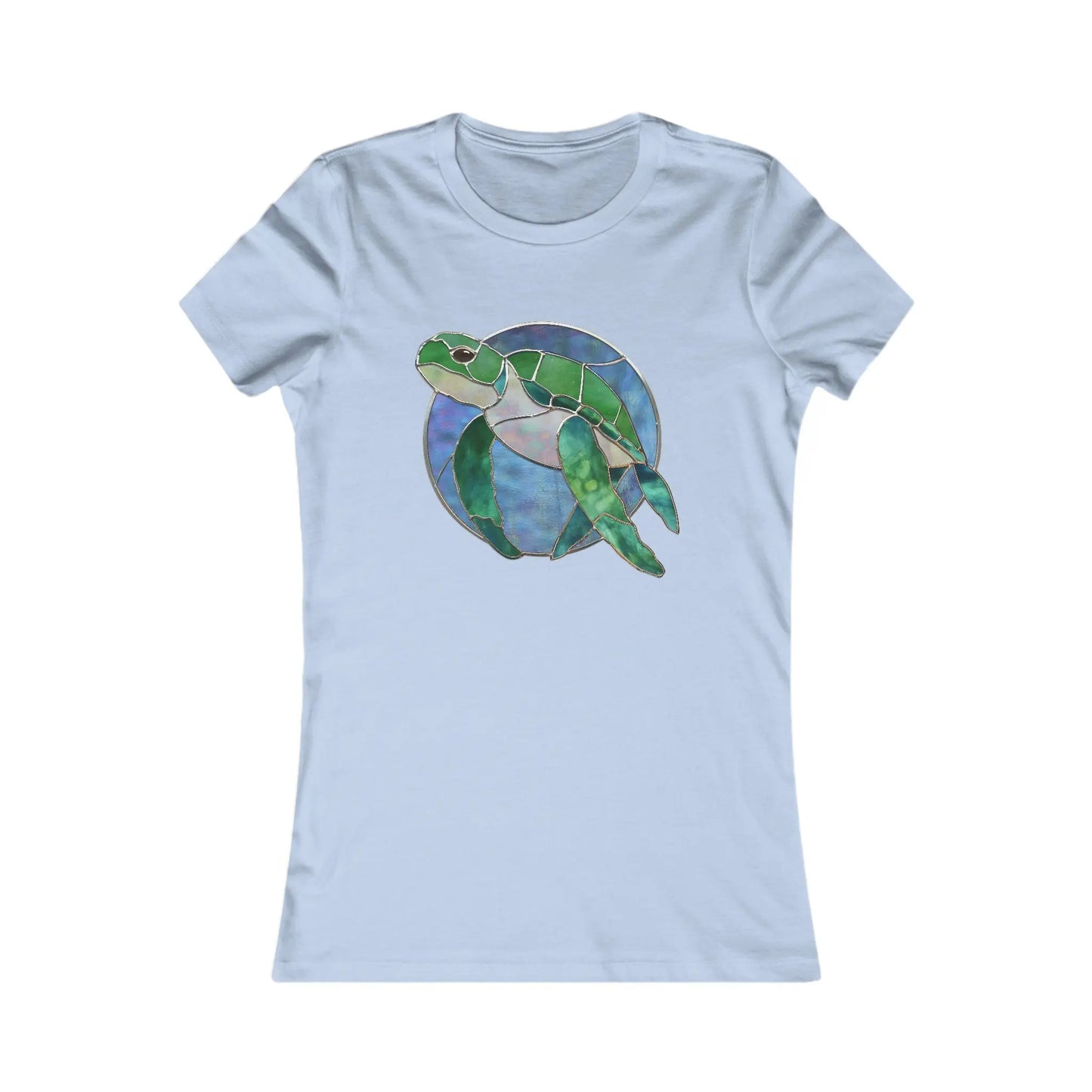 The Stained Glass Turtle Womens Tee Shirt in light blue is a sustainable fashion piece featuring a stained glass-style green sea turtle against a circular blue and purple backdrop, made on demand.