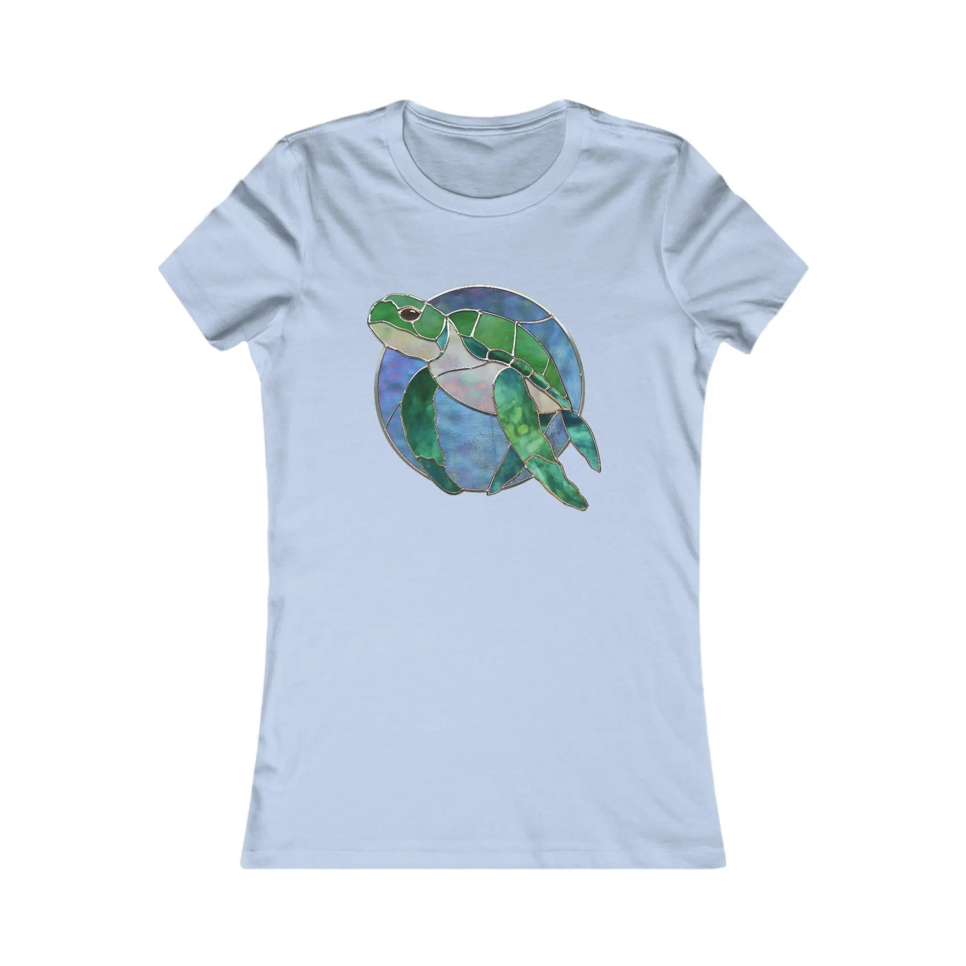 The Stained Glass Turtle Womens Tee Shirt in light blue is a sustainable fashion piece featuring a stained glass-style green sea turtle against a circular blue and purple backdrop, made on demand.