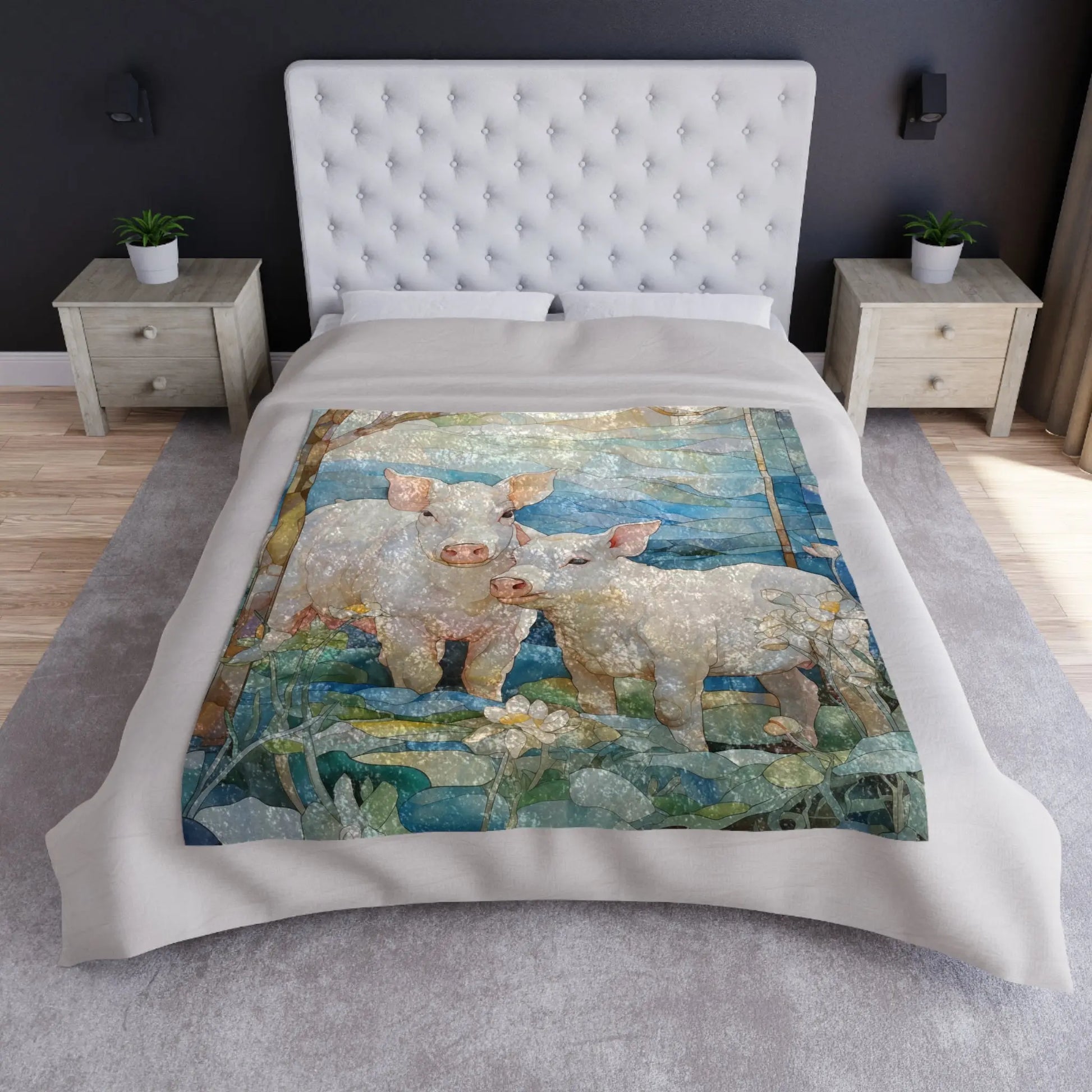 The room features a Stained Glass Piglets Crushed Velvet Blanket (50x60) with pig illustrations in a springtime forest, accented by a tufted headboard, two bedside tables with small plants, and a neutral color scheme that enhances the serene setting.