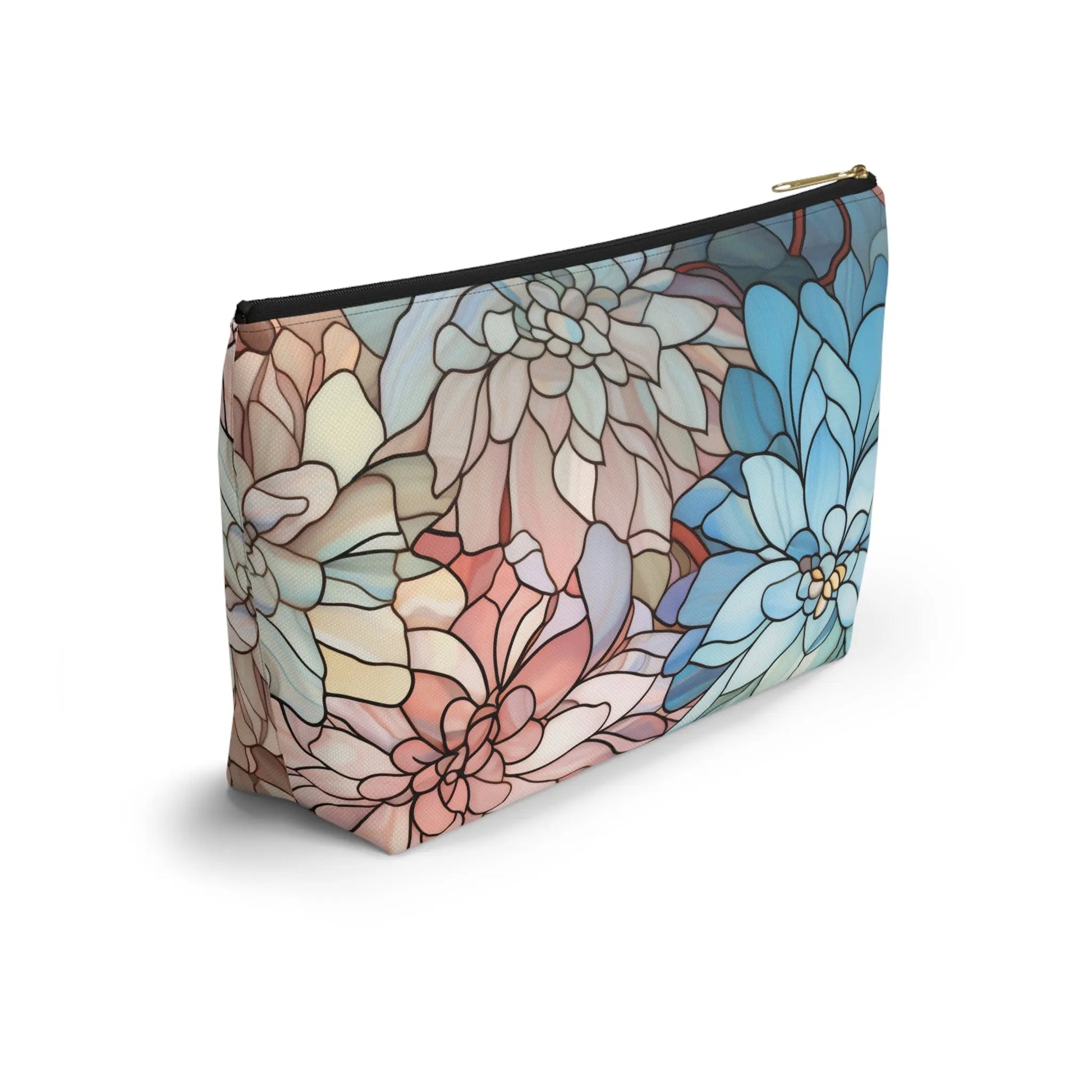 The Stained Glass Dark Flowers Cosmetic Bag is a zippered pouch adorned with a floral design in pastel blues and pinks, standing upright against a white background to beautifully display its boho-inspired pattern.