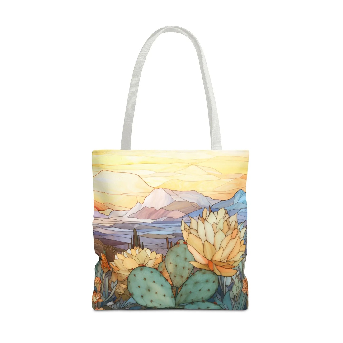 The Stained Glass Desert Cactus Tote Bag, available in three sizes, features a vibrant desert scene with blooming cacti and mountains under a pastel sky. Its made from durable polyester materials and showcases an original artists design.
