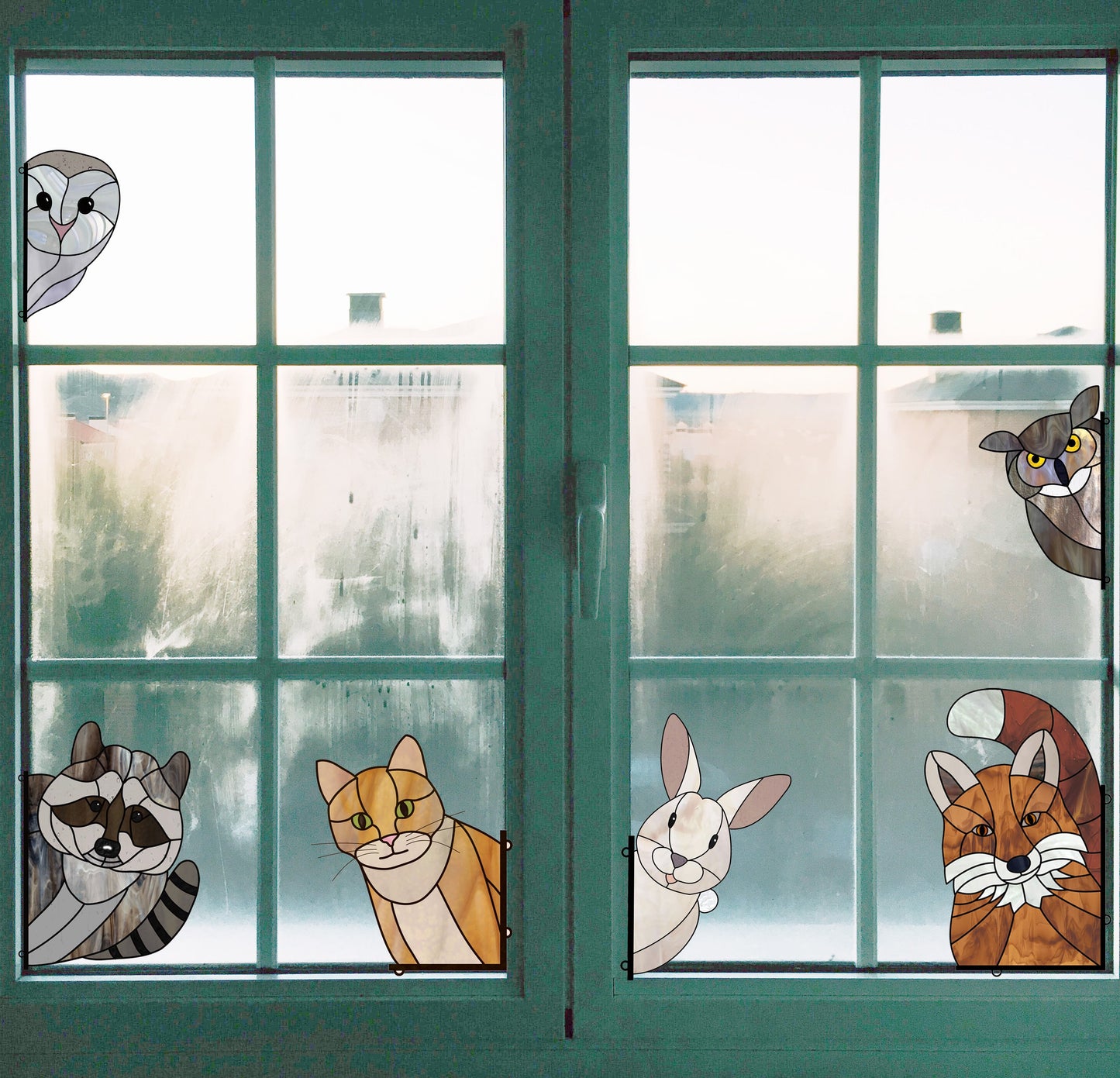 The Animal Stained Glass Pattern 9-Pack features stunning designs of an owl, raccoon, two cats, a rabbit, and a bird on frosted windows. Ideal for intermediate crafters seeking digital downloads with hobby and commercial licenses, creating beautifully foggy views around the scene.
