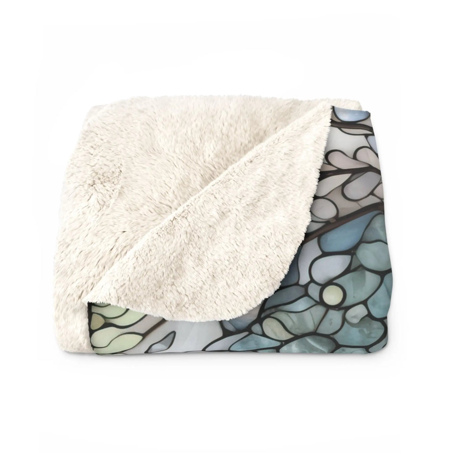 The Stained Glass Nouveau Ferns Sherpa Fleece Blanket, shown folded with one corner flipped, reveals a botanical stained glass-style underside in blue and green, blending comfort with nature-inspired artistry.
