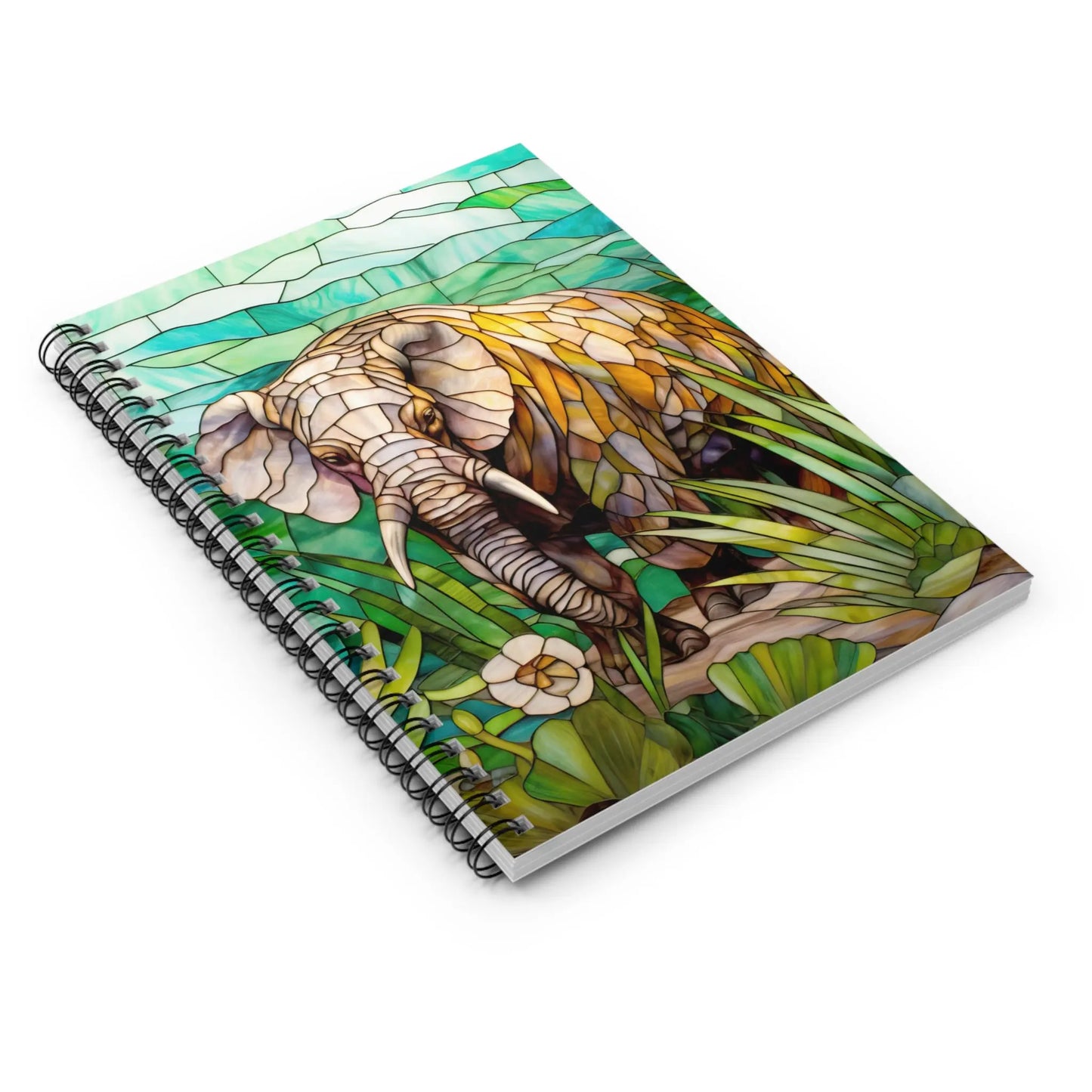 The Stained Glass Elephant Spiral Notebook features a cover with a stained glass-style illustration of an elephant surrounded by lush green foliage and flowers in vibrant shades of green, yellow, and brown, making it an ideal gift for nature lovers.