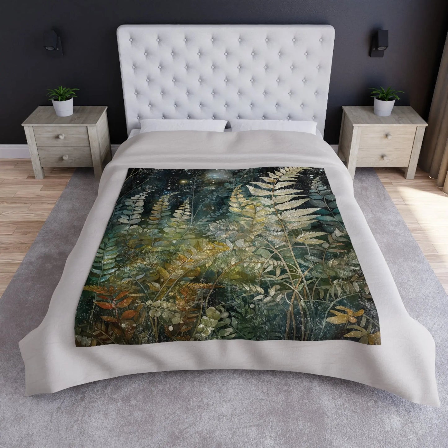 A white tufted headboard bed features a Stained Glass Midnight Ferns Crushed Velvet Blanket in green, blue, and earthy tones. Cozy fleece throws adorn wooden nightstands with small plants, creating warmth against a light gray carpet.
