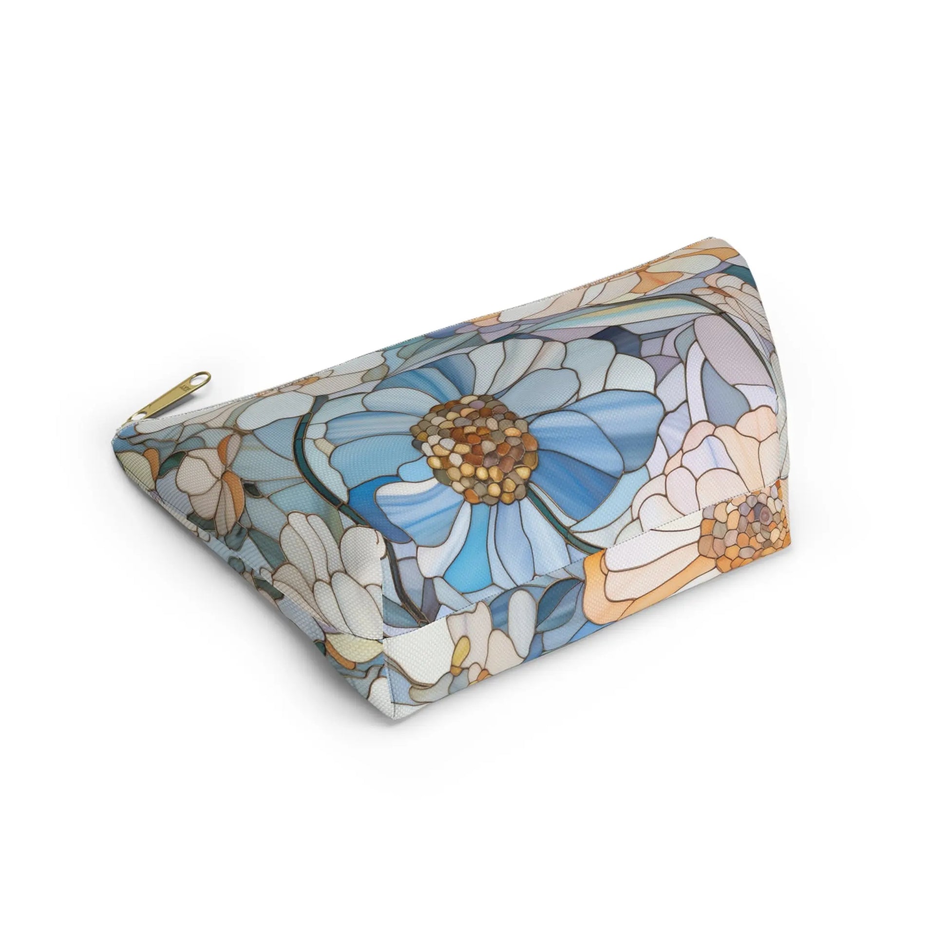 The Stained Glass Flowers Cosmetic Bag is a flat-bottomed cosmetic bag with a top zipper, featuring large, stylized floral patterns in vibrant shades of blue, white, and orange. Ideal as a colorful boho gift.