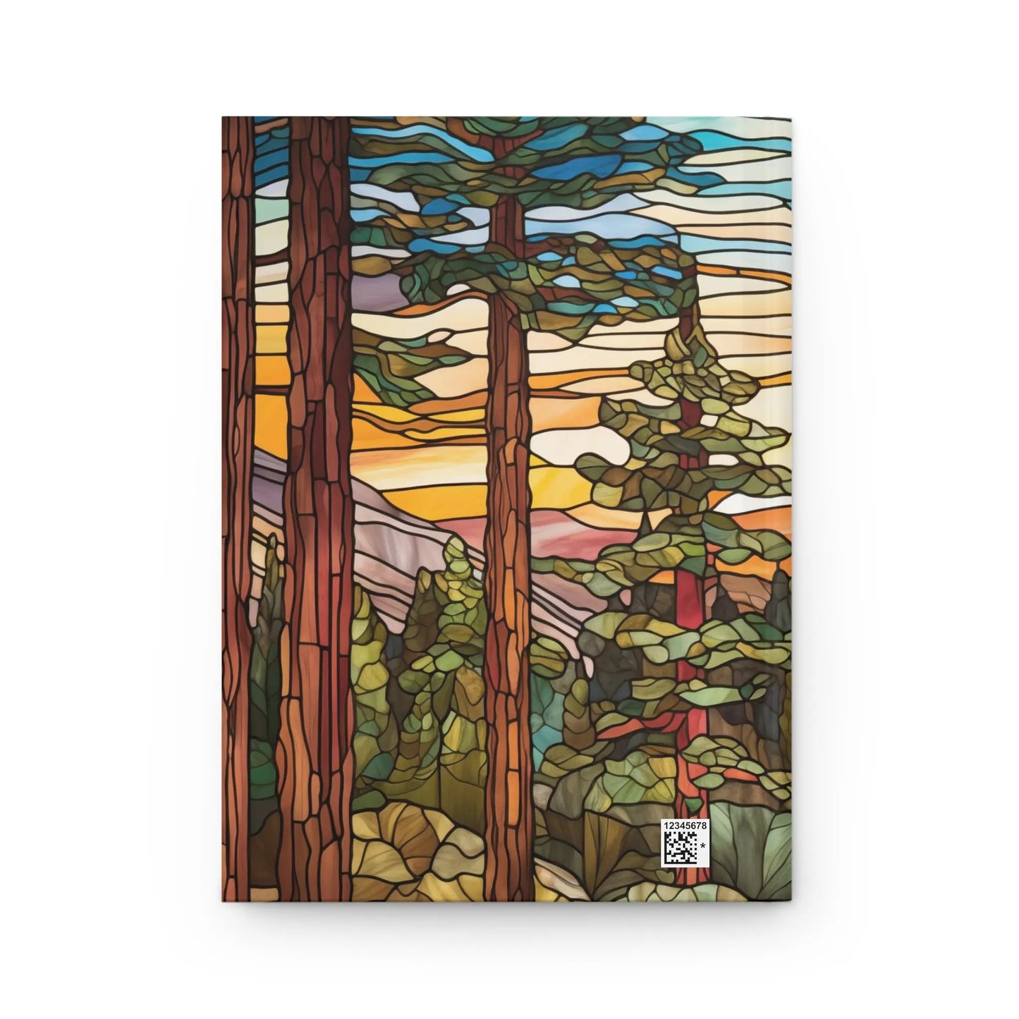 The Stained Glass Sequoia Forest Hardcover Journal showcases tall trees silhouetted against a sunset in orange, pink, and yellow hues. The foreground has lush green foliage with mountains in the distance, and a small QR code enhances the bottom right corner of this unique design.