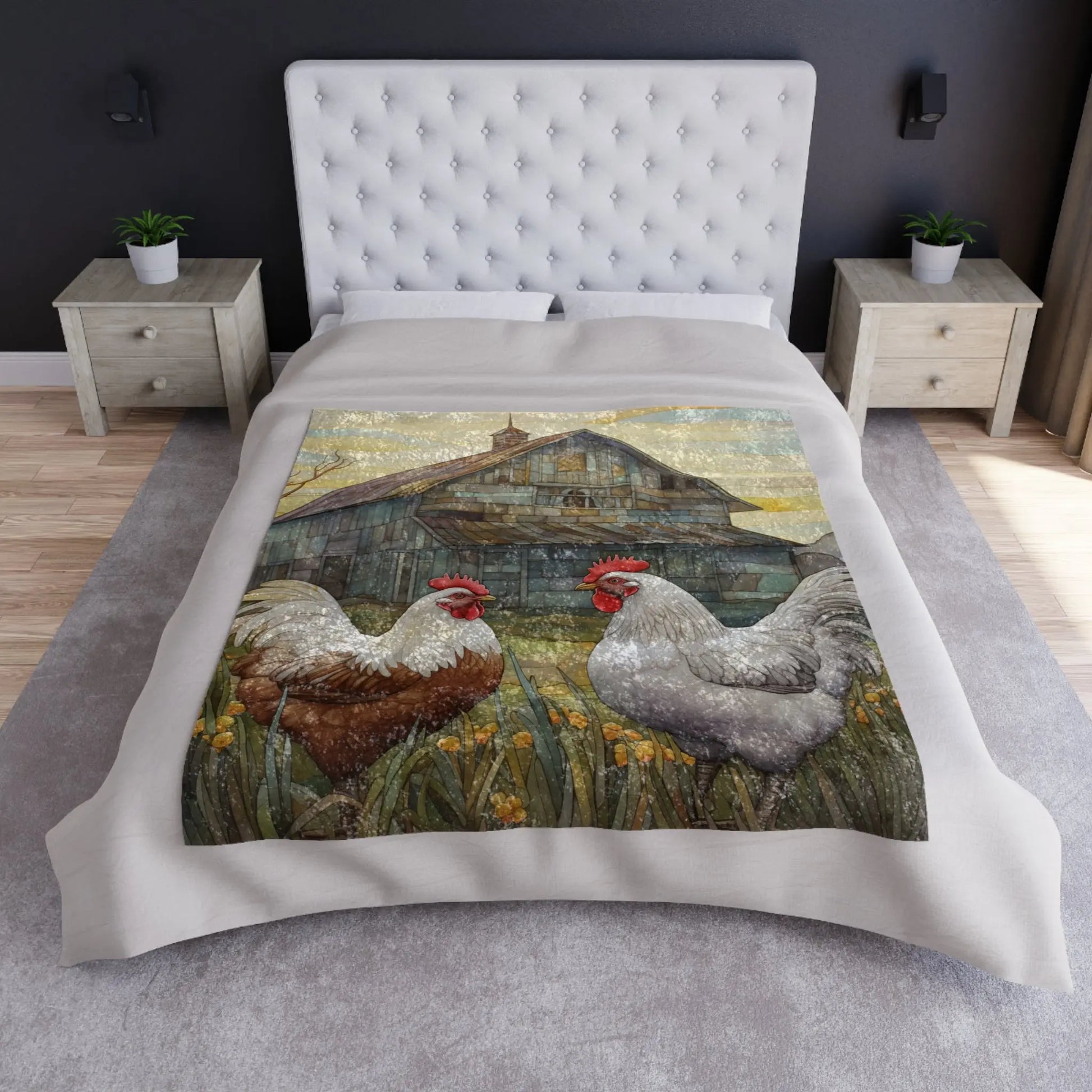 A bed with a Stained Glass Chickens Crushed Velvet & Fleece Blanket showcasing a farm scene, including two chickens in grass with an old barn. The bedroom features a tufted headboard, two wooden nightstands, and gray carpeting.