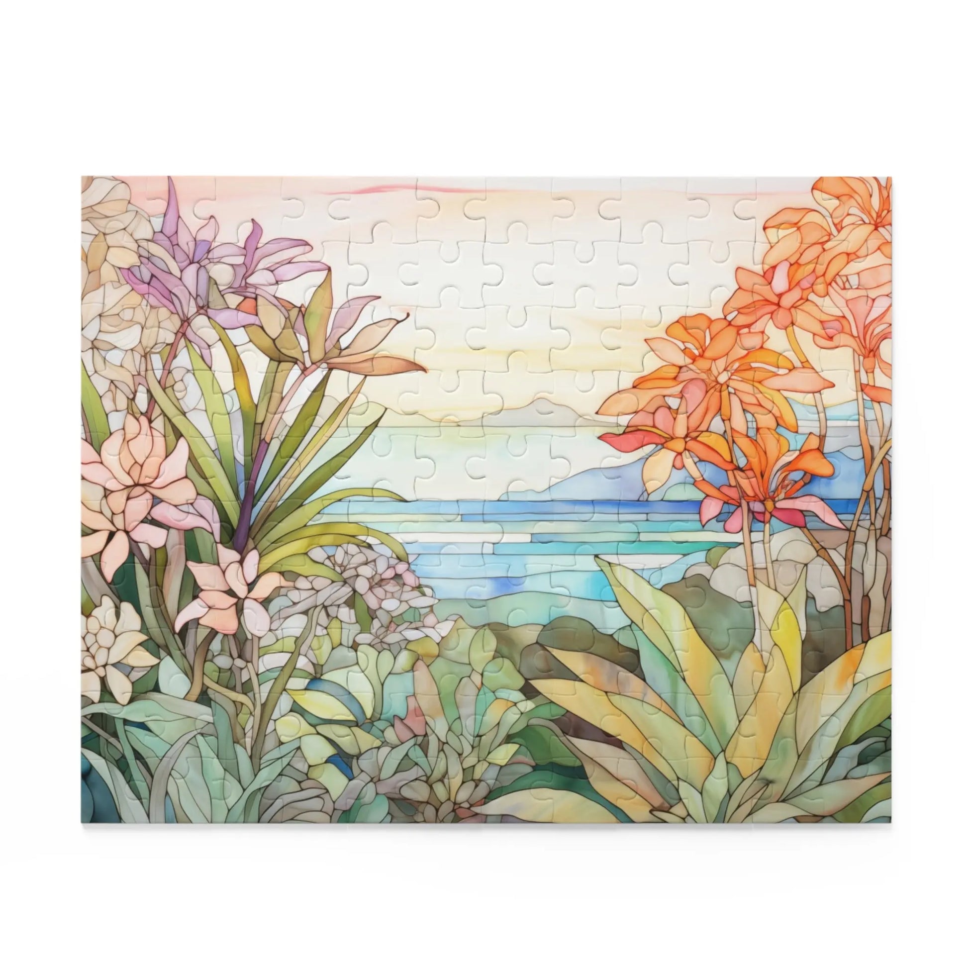 The Tropical Botanicals Jigsaw Puzzle features a serene coastal landscape with vibrant pink, orange, and green botanicals. The design, inspired by stained glass art, showcases flowers and leaves against a blue ocean backdrop with a soft sky and mountains.