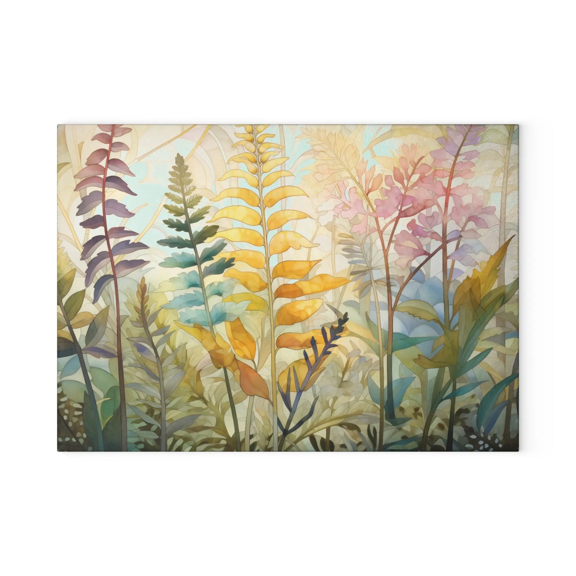 The Stained Glass Pastel Ferns Glass Cutting Board displays a digital artwork of vividly colored ferns and leaves in yellow, orange, green, and pink on a light background, evoking a whimsical and serene stained glass design.