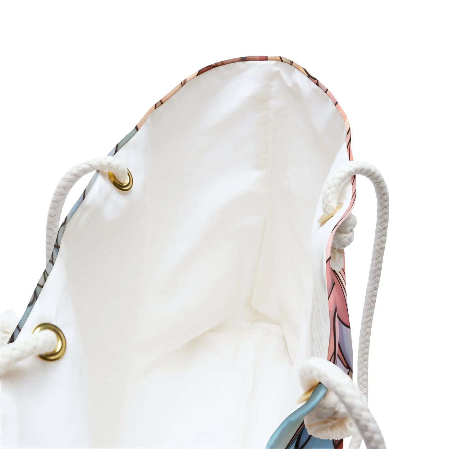 View the Stained Glass Dark Flowers Oversized Tote Bag, showcasing a multicolored stained glass pattern with blue, pink, and beige hints. It features a white interior, gold-toned eyelets, and white rope handles.