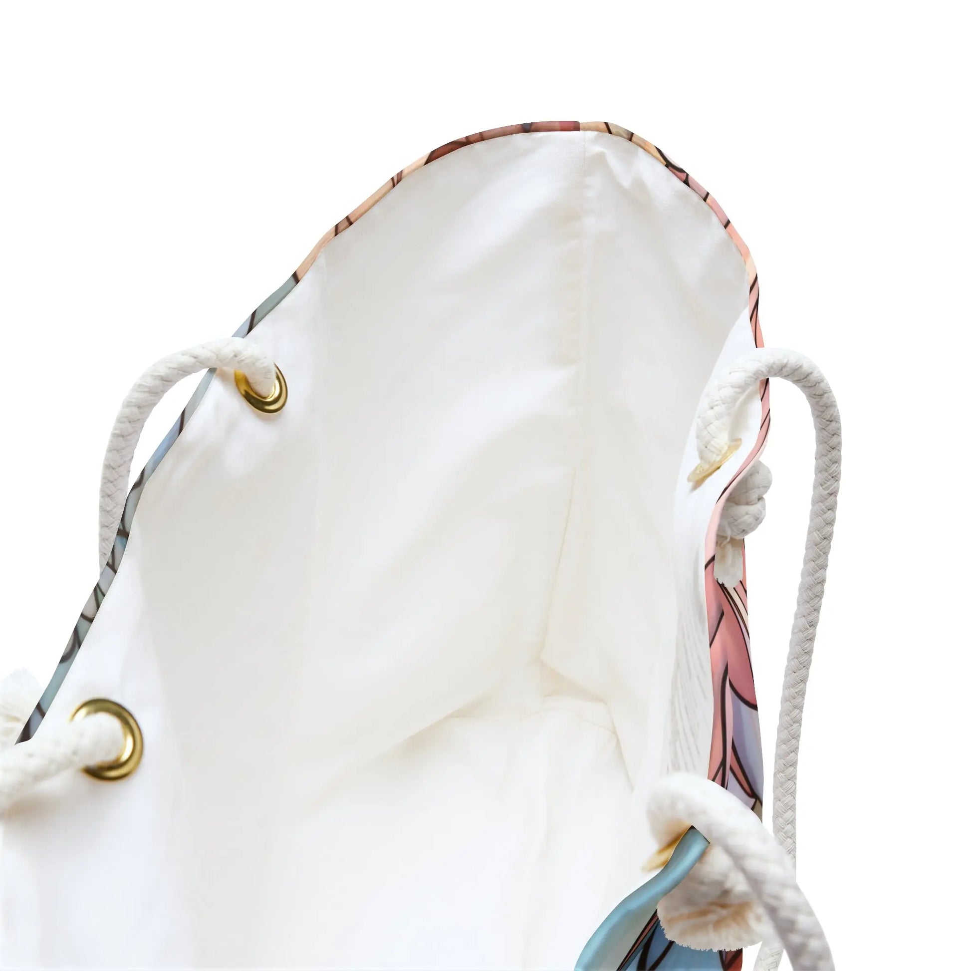 View the Stained Glass Dark Flowers Oversized Tote Bag, showcasing a multicolored stained glass pattern with blue, pink, and beige hints. It features a white interior, gold-toned eyelets, and white rope handles.