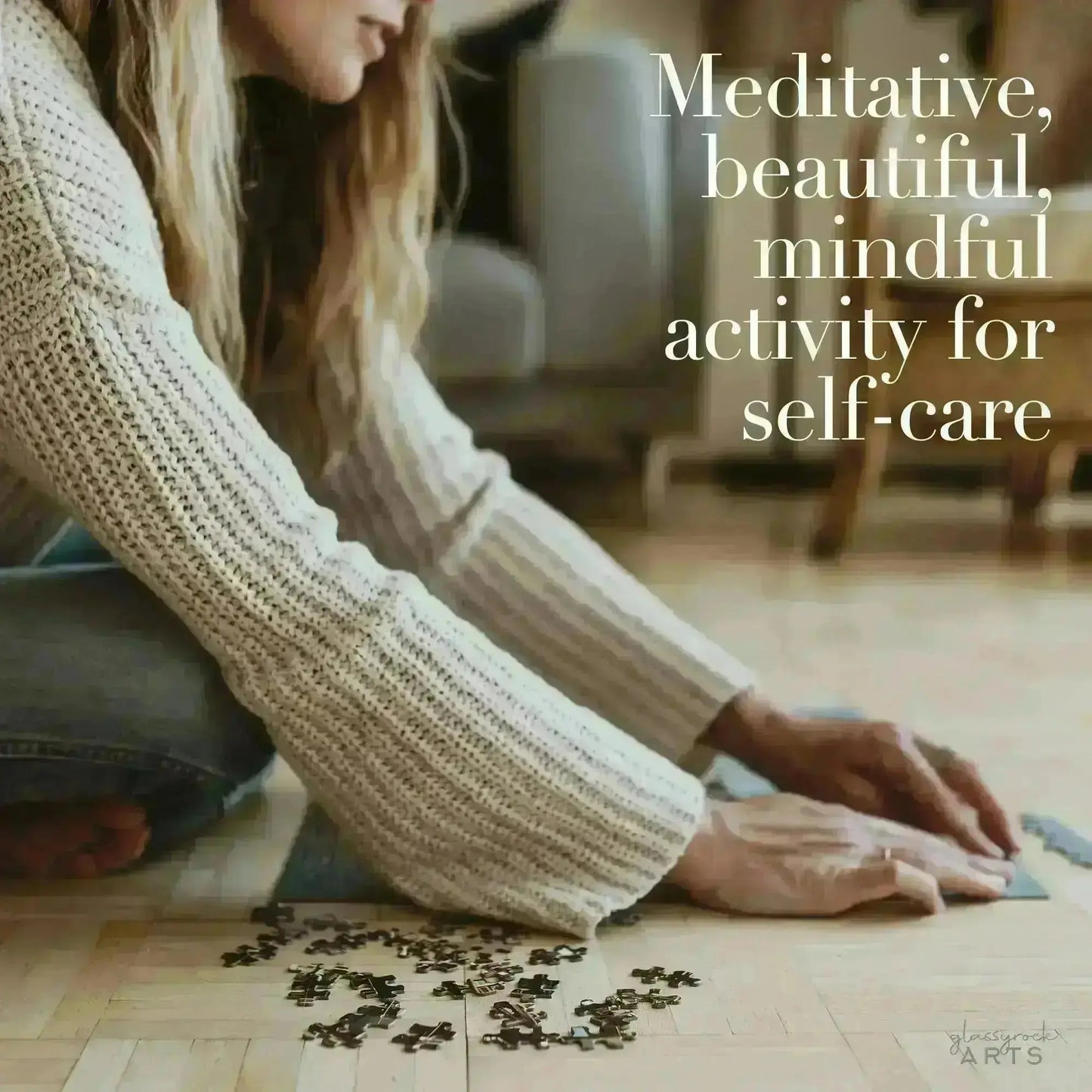 Wearing a knit sweater, a puzzle enthusiast pieces together the Sea Turtle Reef Jigsaw Puzzle on the wooden floor, labeled as Meditative, beautiful, mindful activity for self-care.