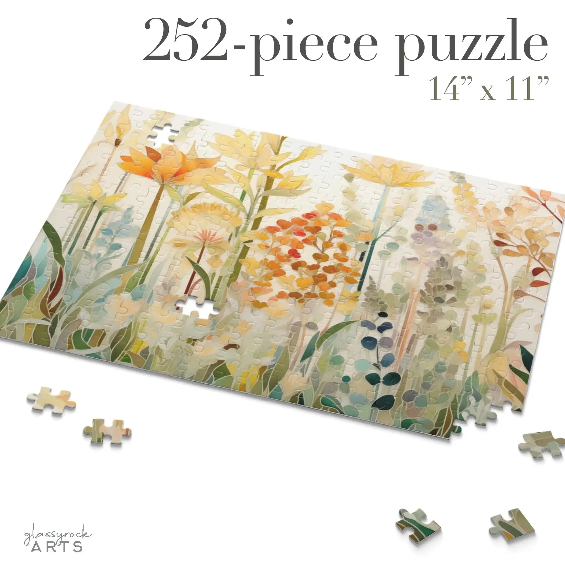 A partially completed 252-piece Autumn Botanicals Jigsaw Puzzle displays vivid flowers and greenery, surrounded by loose pieces. The text reads 252-piece puzzle 14\ x 11\ and features the glassrock ARTS logo, making it an ideal art gift.