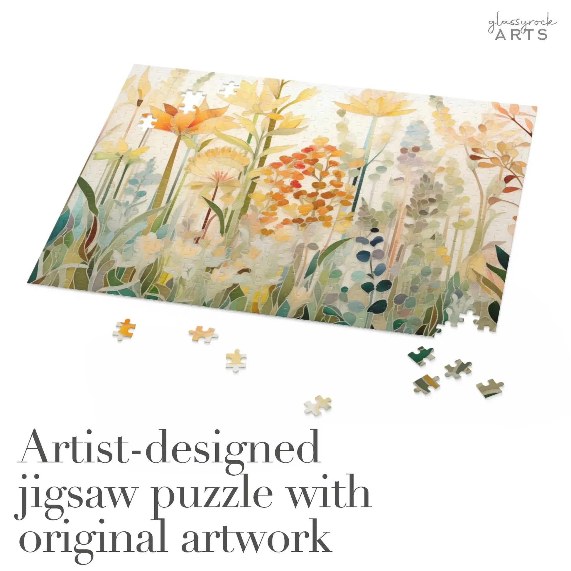 The Autumn Botanicals Jigsaw Puzzle displays an artist-designed floral artwork in warm hues. Scattered pieces surround the partially completed puzzle. Text reads: Artist-designed jigsaw puzzle with original artwork. Ideal art gift for enthusiasts.