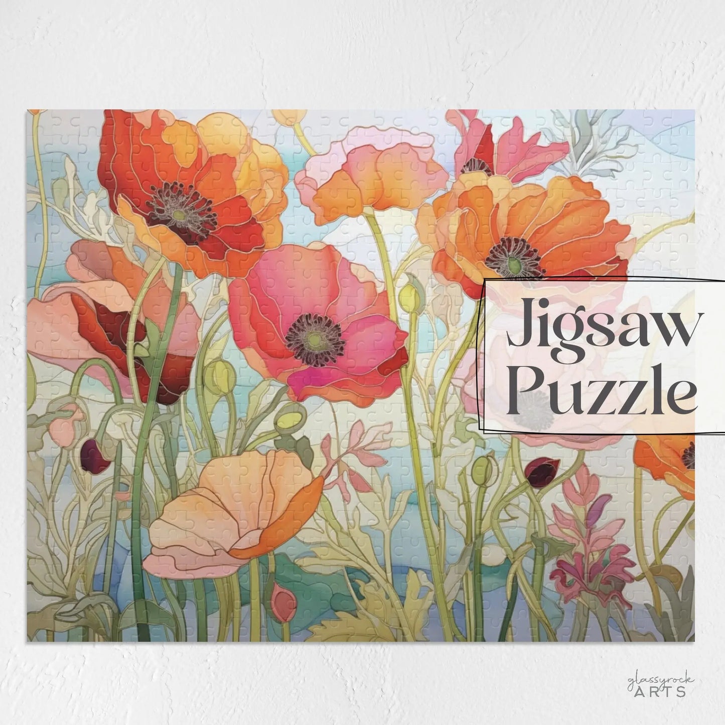 The California Poppies Jigsaw Puzzle features a stained glass-inspired colorful field of red, orange poppies with green stems and leaves, set against a soft sky blue background. Jigsaw Puzzle is on the right side, making it an ideal art gift.
