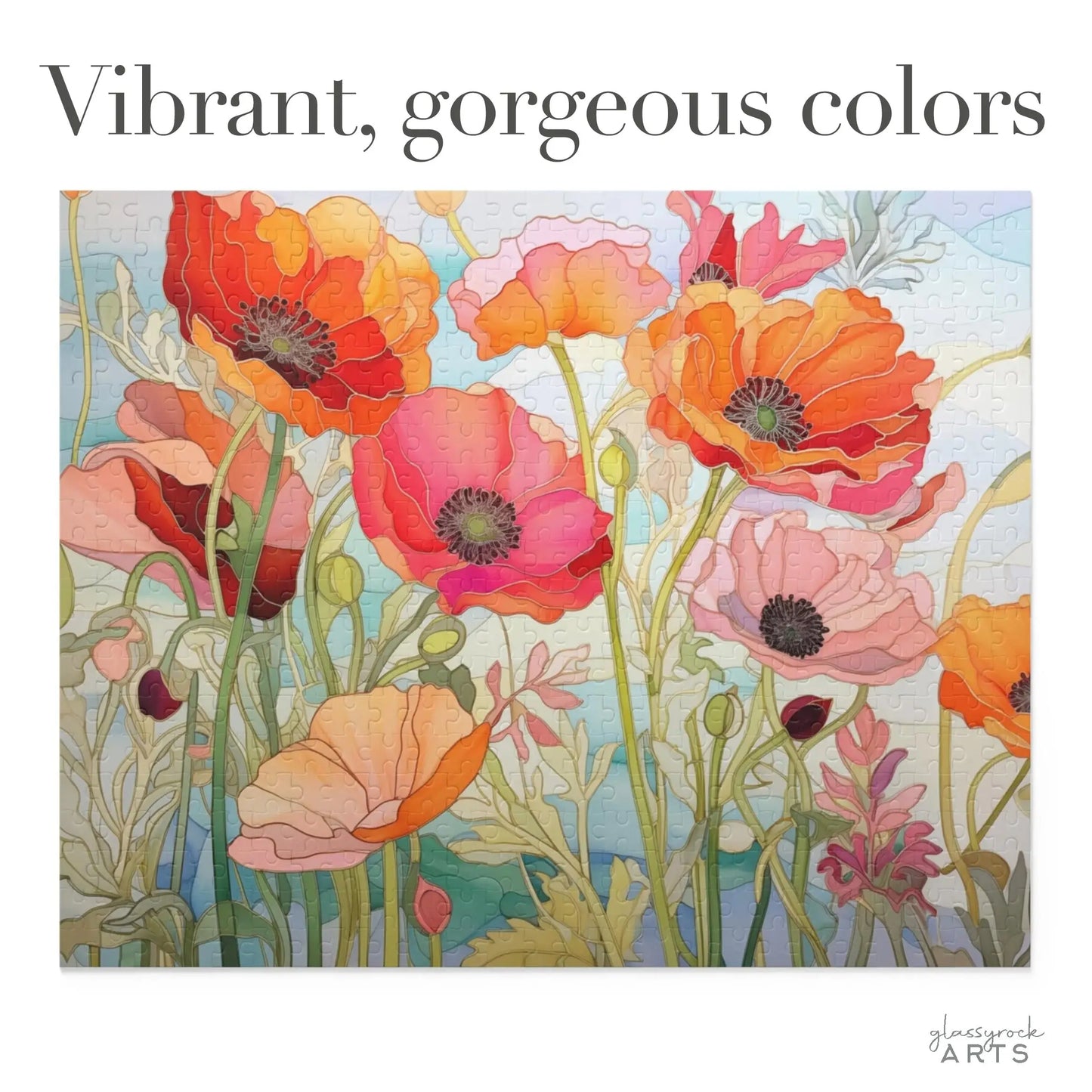 The California Poppies Jigsaw Puzzle showcases vibrant, blooming poppies in red, pink, and orange on a light blue-green background. The cheerful design includes bold text saying Vibrant, gorgeous colors, making it an ideal artistic gift.