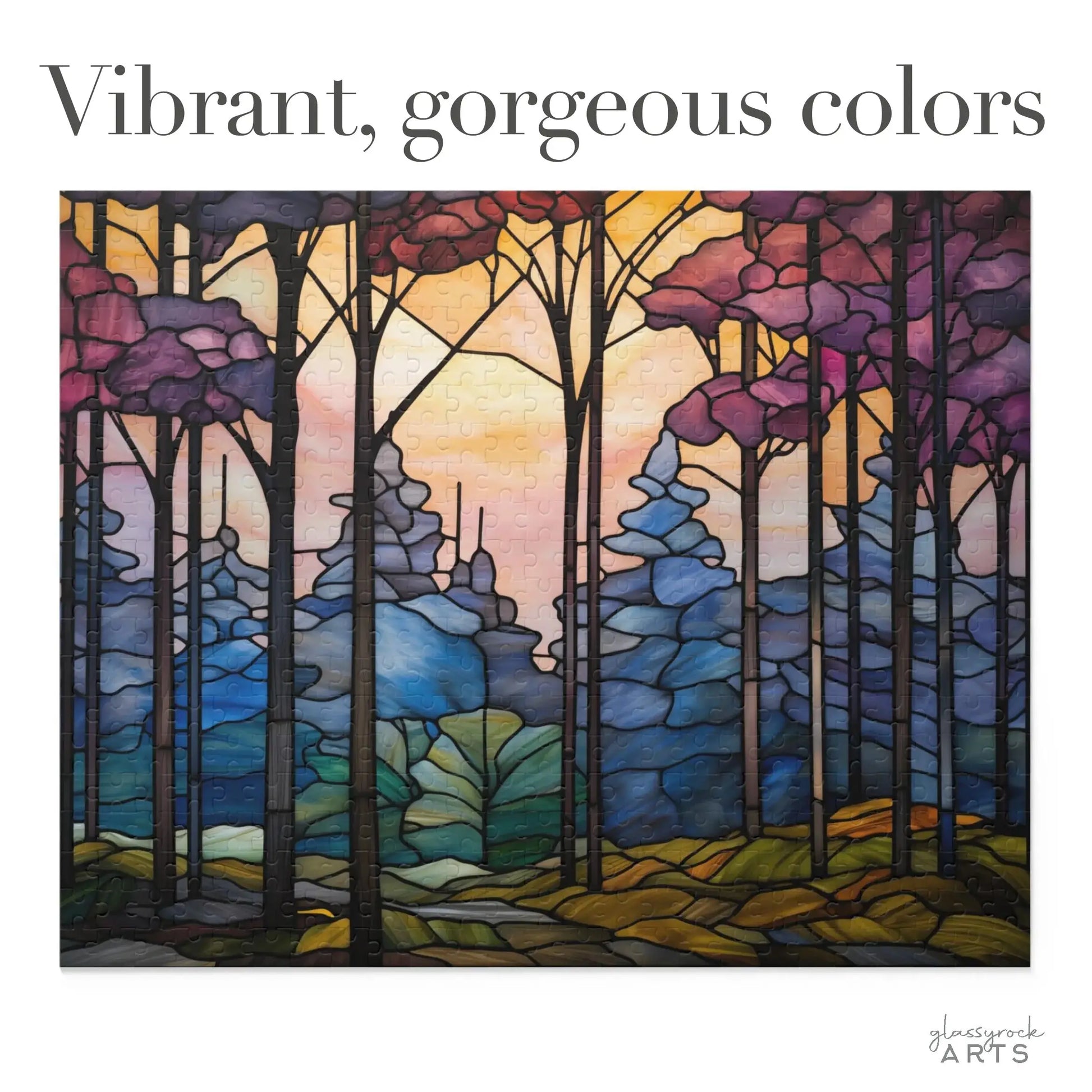 The Dark Woods Forest Jigsaw Puzzle features a colorful scene with tall trees against a vibrant sunset sky, blending purple, pink, and orange hues with shades of blue and green. The text reads Vibrant, gorgeous colors, reminiscent of a stained glass gift.