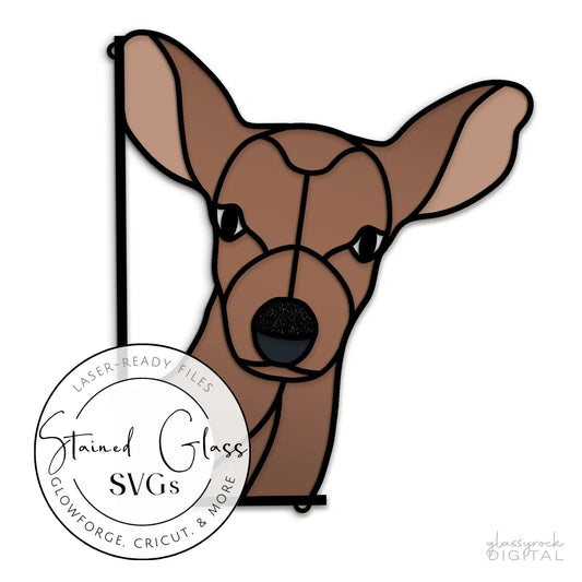 A stained glass deer face with large ears, illustrated in brown shades with black outlines, makes the perfect pattern. A circular label on the lower left reads Stained Glass Deer Buddy SVGs and mentions laser-ready crafting files.