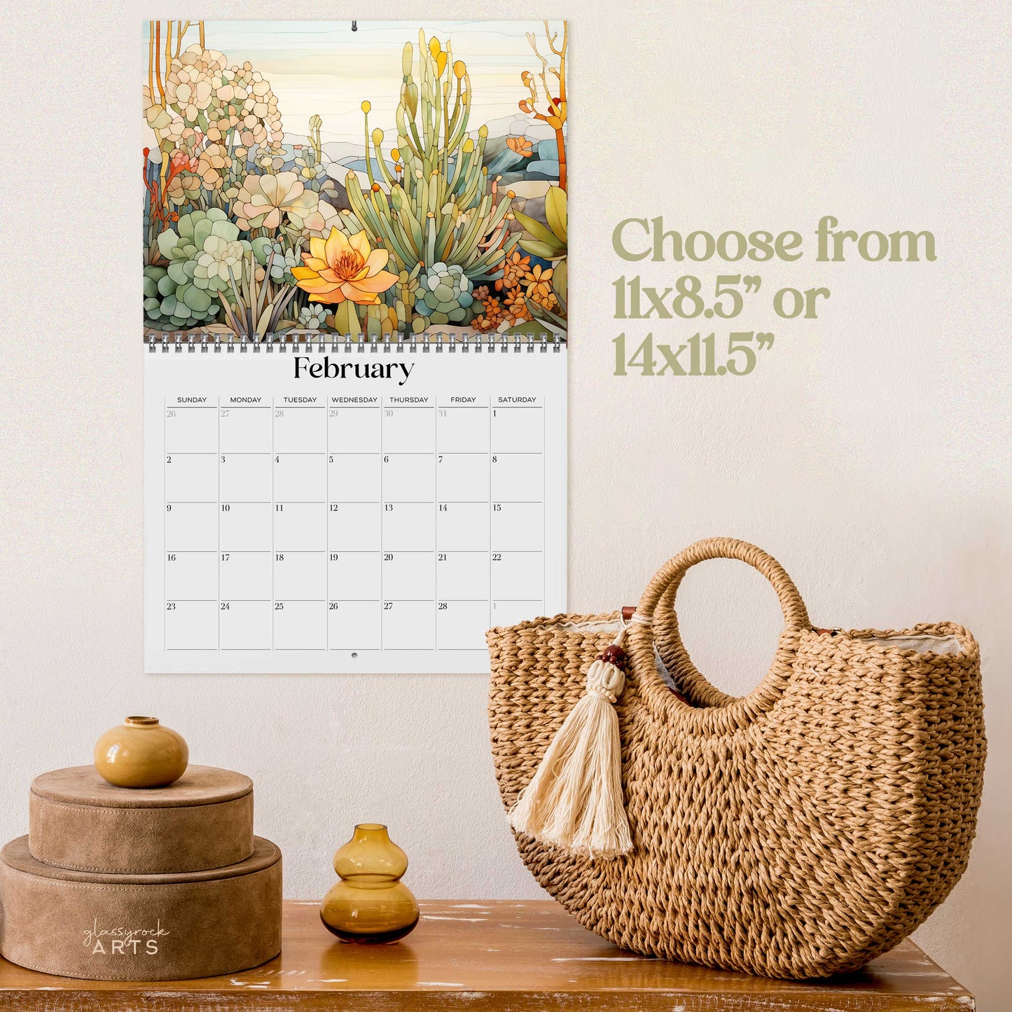 The 2025 Wall Calendar - Stained Glass Desert Landscapes, with spiral binding and a centered hole for hanging, features vivid desert illustrations.