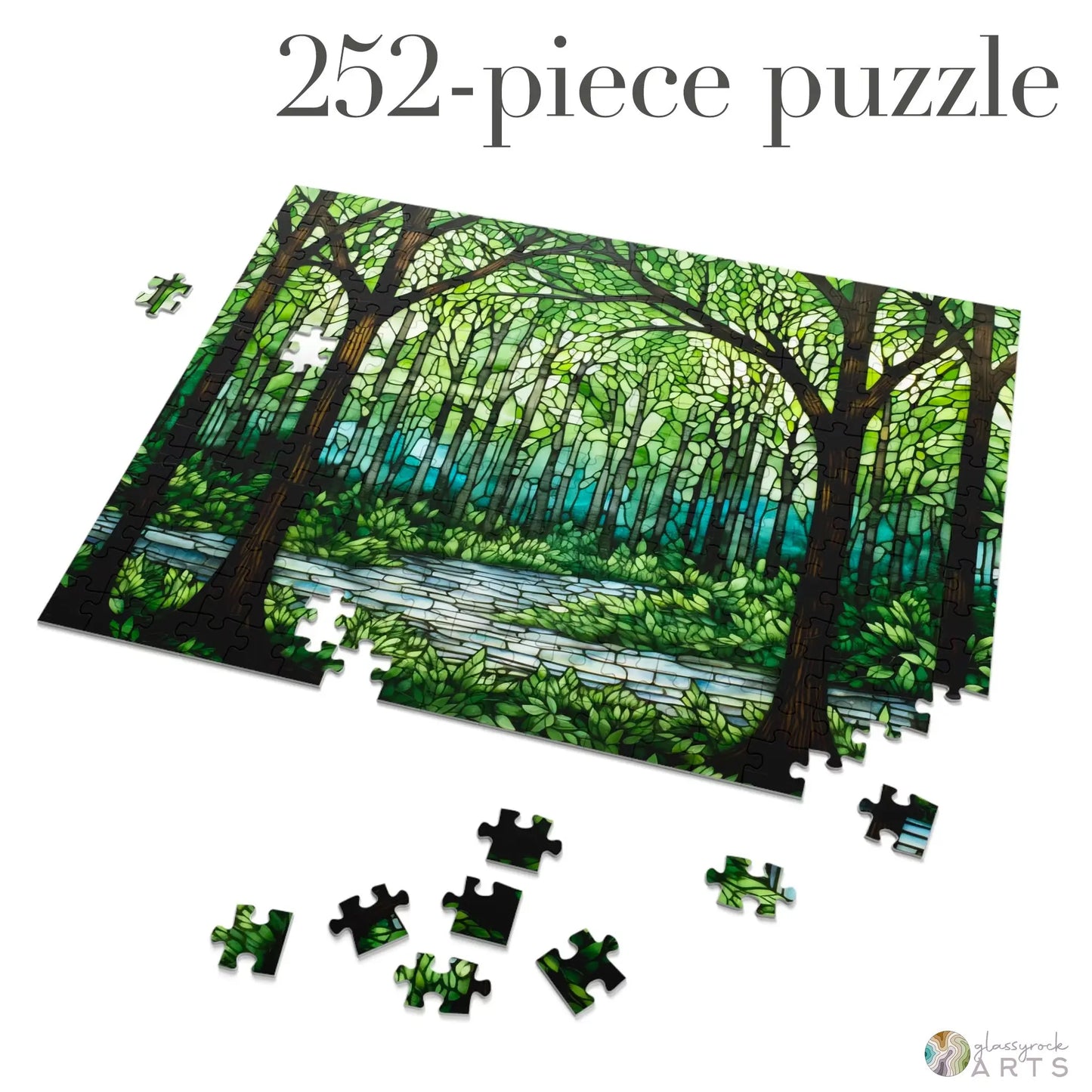 The Stained Glass Forest Jigsaw Puzzle, partially completed with 252 pieces, beautifully depicts a forest scene with trees and a shimmering river. Several pieces remain scattered, making it a perfect puzzle gift for nature lovers and enthusiasts.