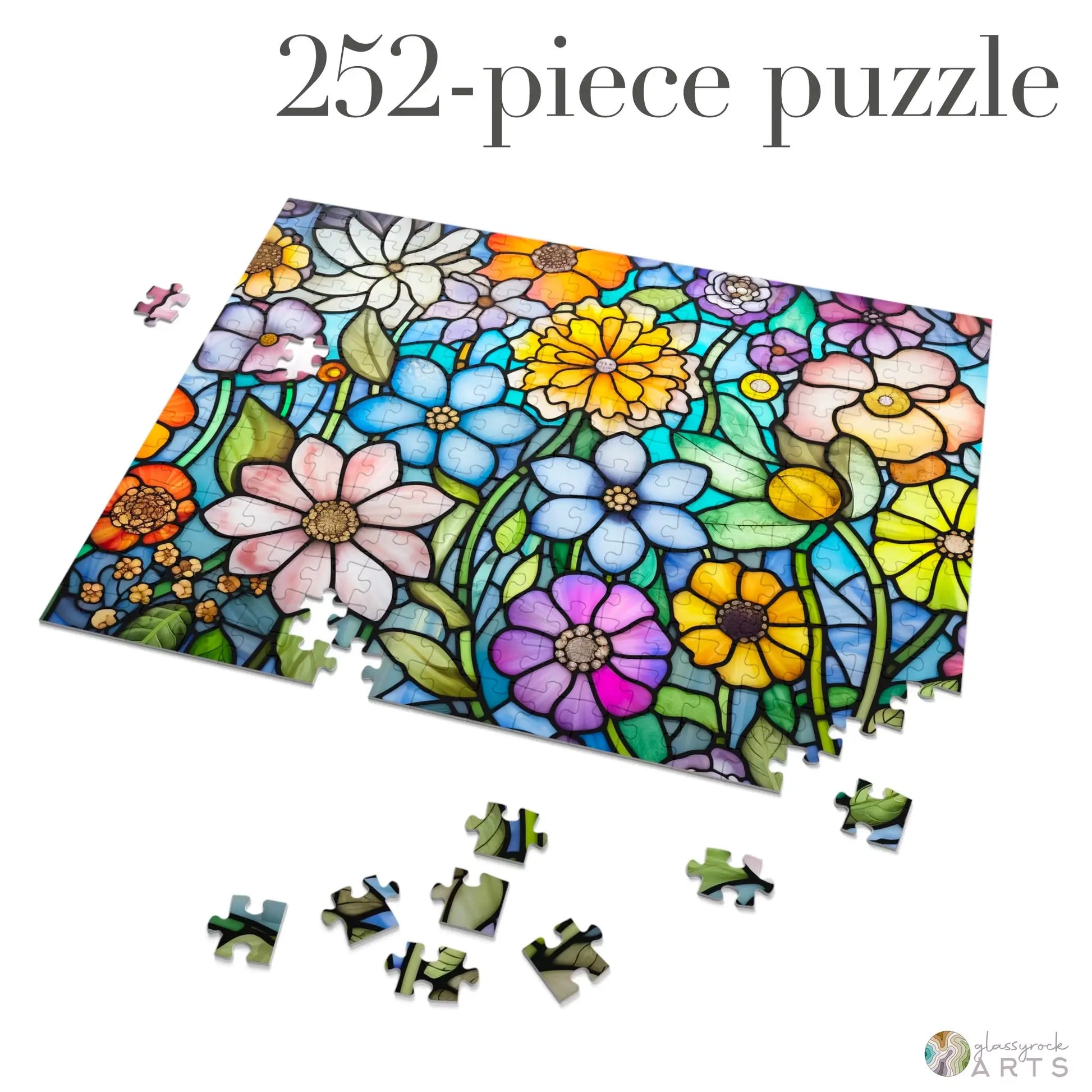 The Stained Glass Flower Garden Jigsaw Puzzle is a 252-piece colorful puzzle with vibrant flowers. Crafted from high-quality chipboard, it includes partially completed sections and scattered pieces, making it an ideal gift for puzzle enthusiasts.
