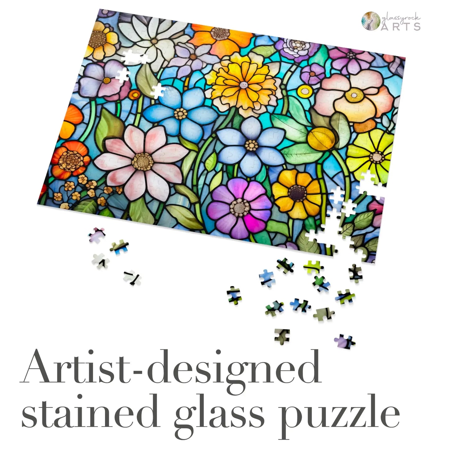 The Stained Glass Flower Garden Jigsaw Puzzle is a vibrant floral puzzle with high-quality chipboard pieces, some assembled. It features the artist-designed beauty of stained glass and reads Artist-designed stained glass puzzle, making it an ideal gift for puzzle enthusiasts.