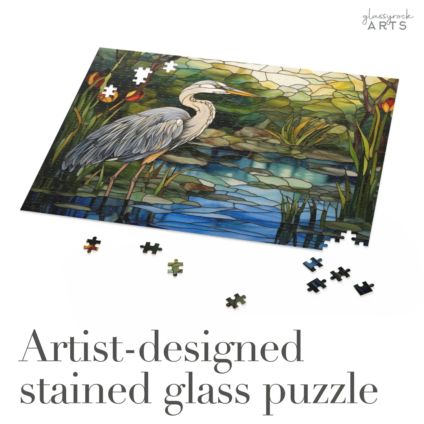 A jigsaw puzzle featuring a colorful blue heron rendered in stained glass. It is an artist-designed stained glass puzzle.