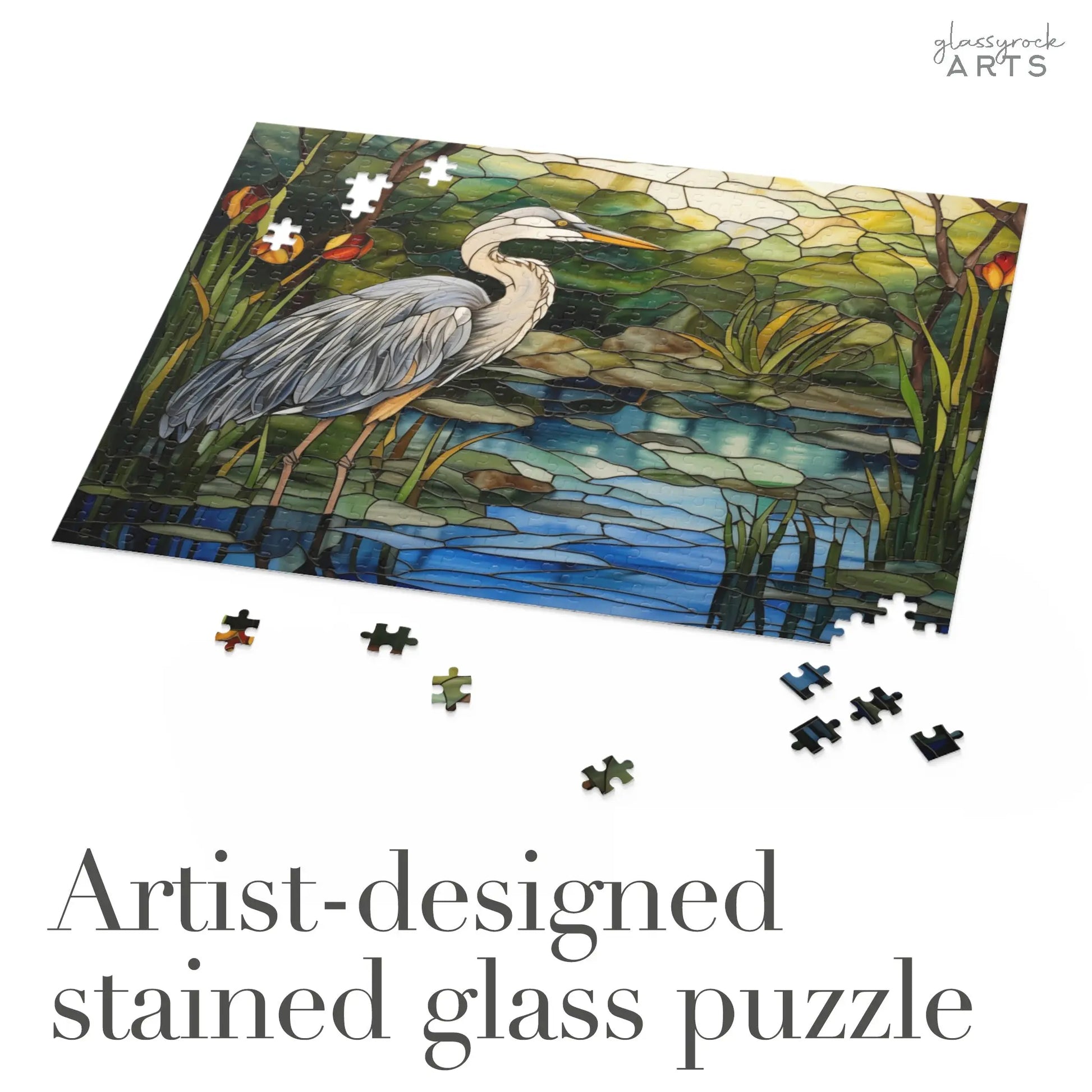 A jigsaw puzzle featuring a colorful blue heron rendered in stained glass. It is an artist-designed stained glass puzzle.