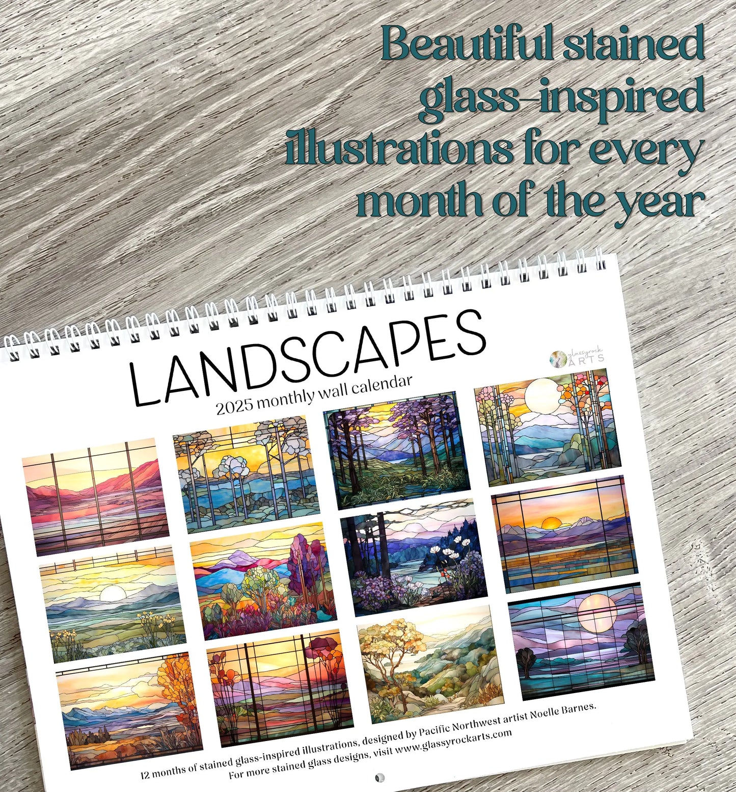 A 2025 Landscapes Stained Glass Wall Calendar features stunning nature landscape art. Text reads, Beautiful stained glass-inspired illustrations for every month, capturing the enchanting essence of this monthly wall calendar. Displayed on a wooden surface, it embodies elegance and charm.