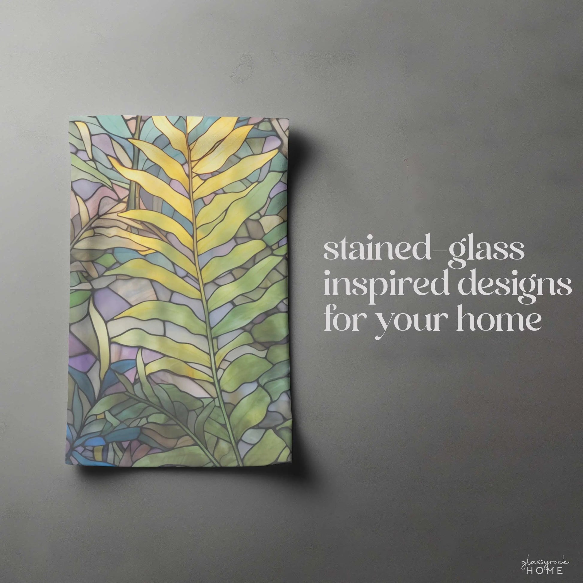 A Pacific Northwest artists rectangular decor piece, stained glass inspired with green and yellow leaf patterns on gray, reads, stained-glass inspired designs for your home. Available as the Stained Glass Pastel Ferns Dish Towel: perfect as a custom item or kitchen towel.