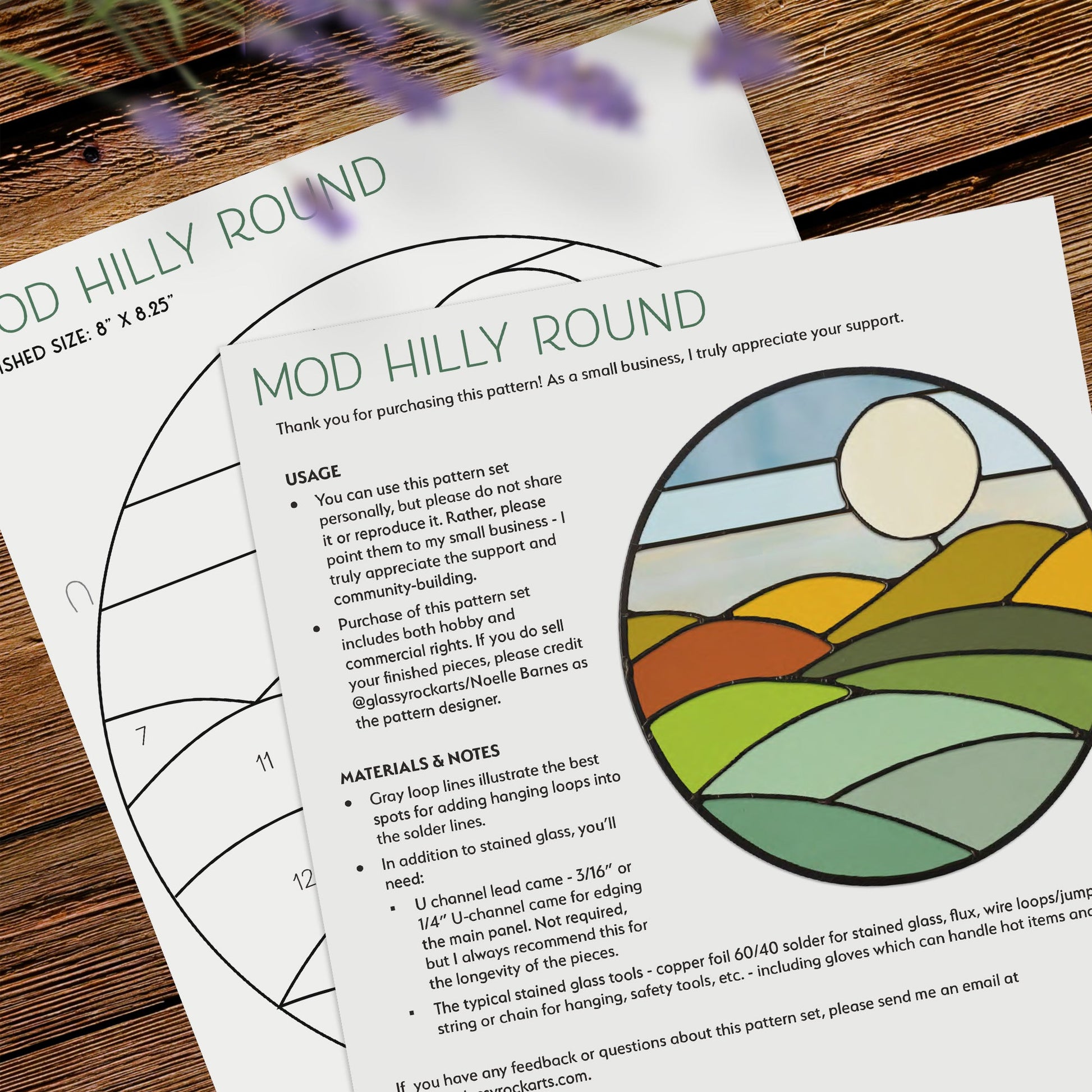 The Round Mod Landscape Stained Glass Pattern is a digital download featuring a stunning sun catcher design with a sunrise over hills. Lavender flowers peek from the top corner, and it includes usage instructions and material notes.